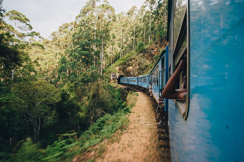 Taking the train is one of the most memorable experiences in Sri Lanka. (Photo by John Crux Photography / Getty Images.)