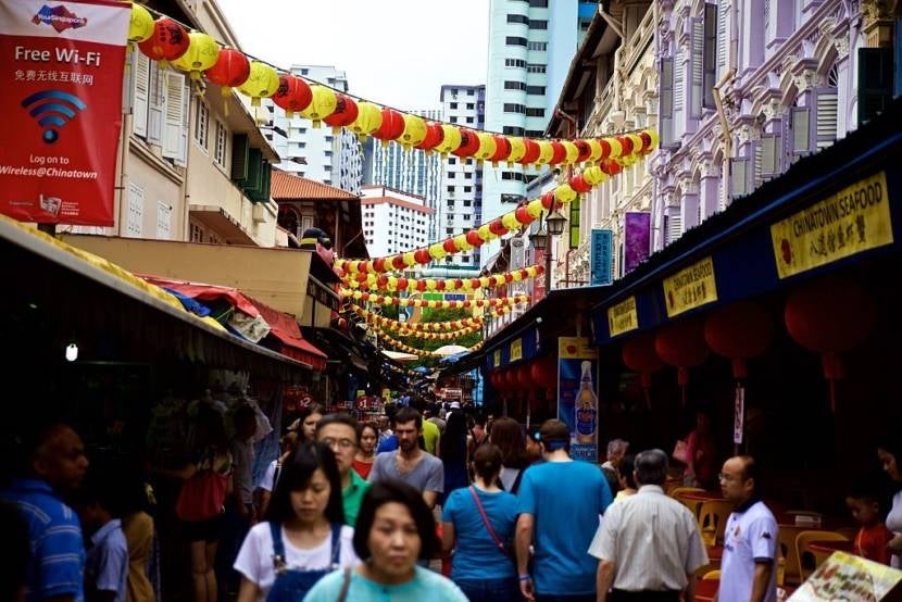 CHINATOWN, SINGAPORE - FEBRUARY 08: People walk through the market on the day of Chinese New Year "Monkey" at the Buddhist temple in Chinatown, Singapore on February 8, 2016. (Photo by Mithila Jariwala/Anadolu Agency/Getty Images)
