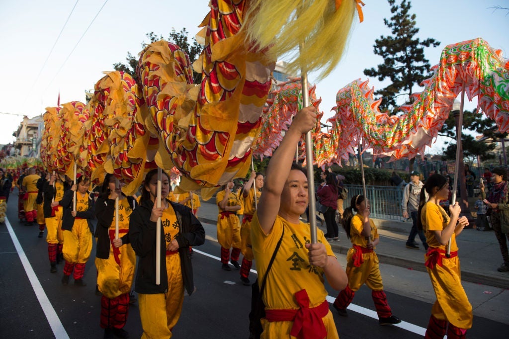 A lion dance team performs during San Francisco's Chinese New Year Parade, Feb. 11, 2017 (Photo by Yichuan Cao/NurPhoto via Getty Images)