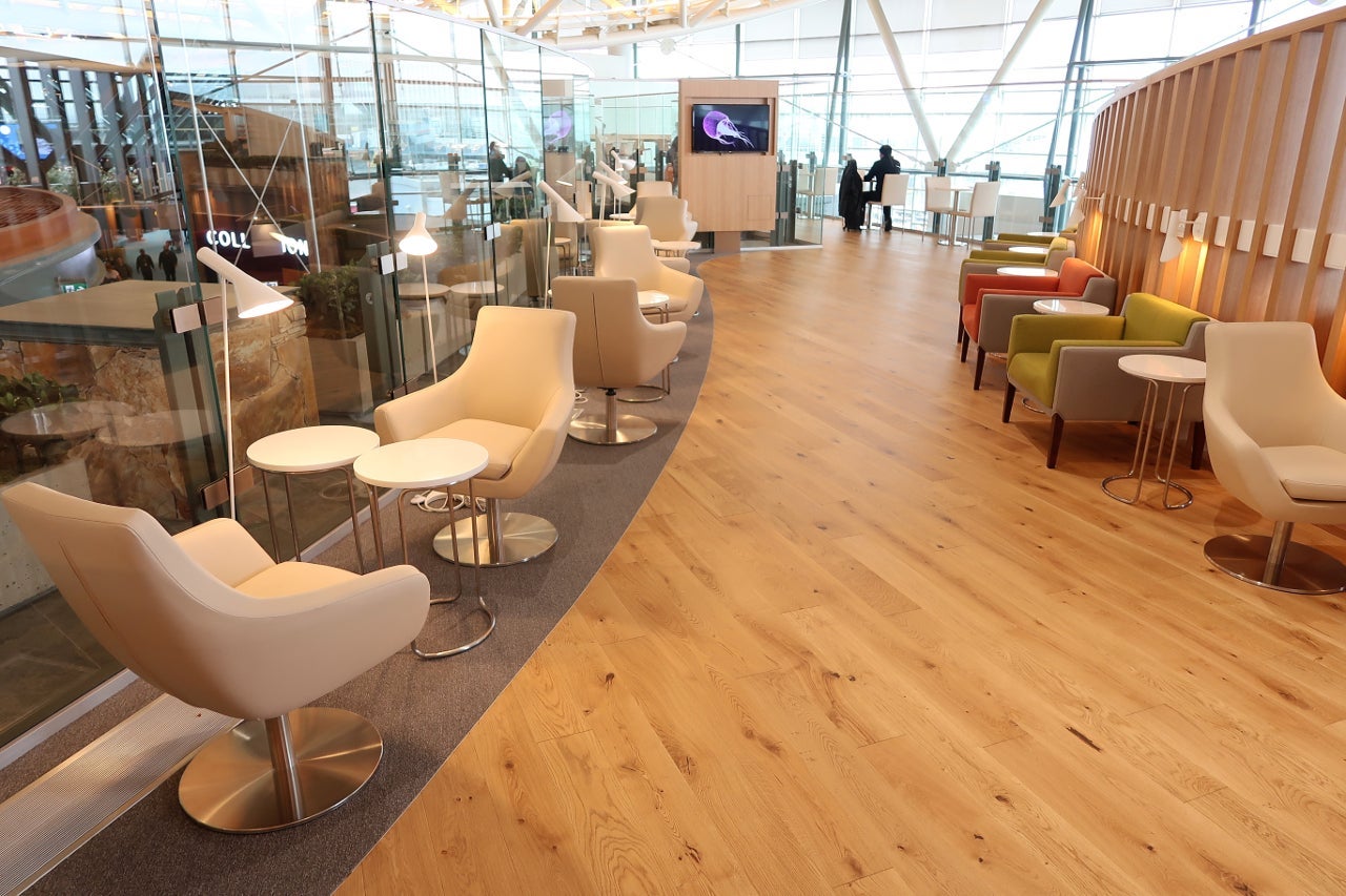 a spacious airport lounge with lots of seating