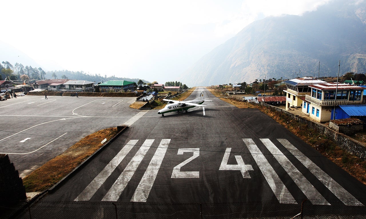 A Tara Air Dornier Do 228 aircraft taxis after landing at the Tenzing-Hillary Airport in Lukla, 87 miles northeast of Kathmandu. (Photo by PRAKASH MATHEMA/AFP/Getty Images)