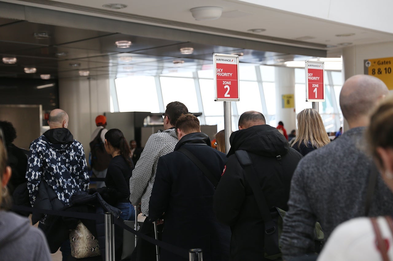people waiting to board a flight