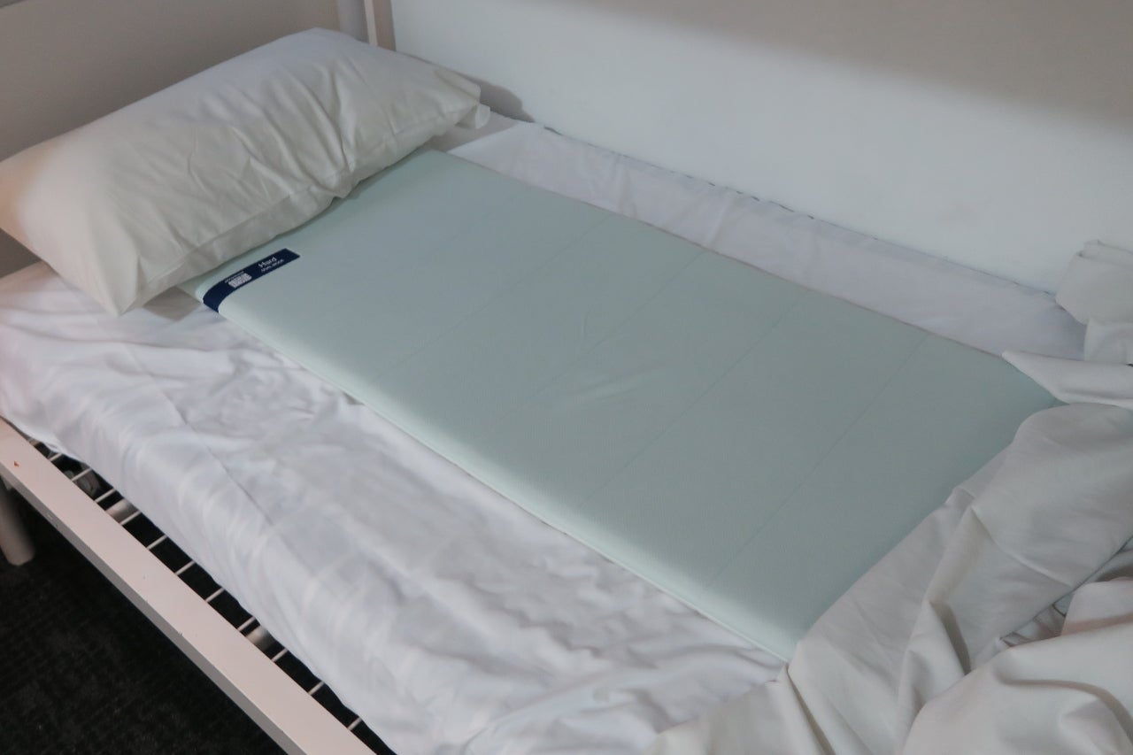 The Traveler on a twin bed. Photo by the author.