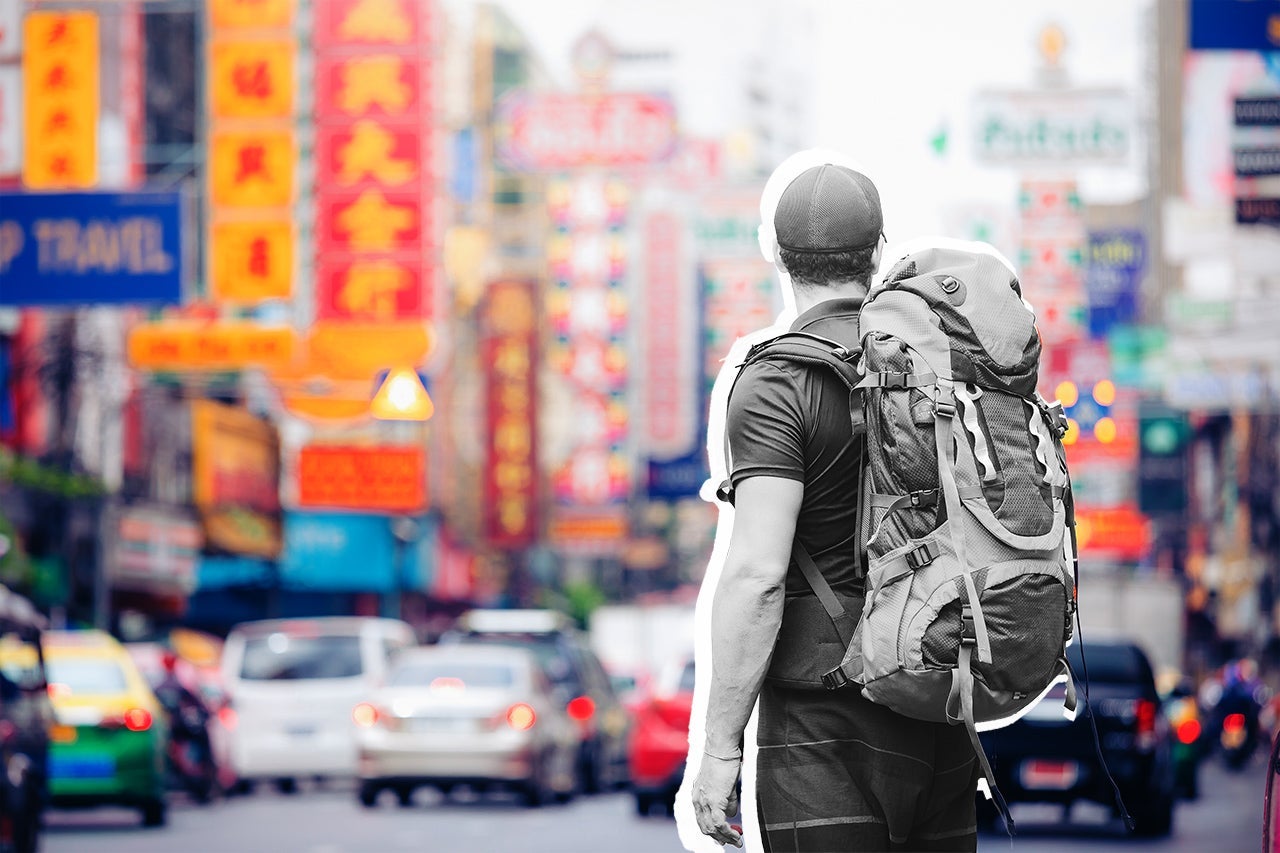 tourist backpacker visiting a city in southeast asia. (Photo by Pascal Kiszon/Getty Images)