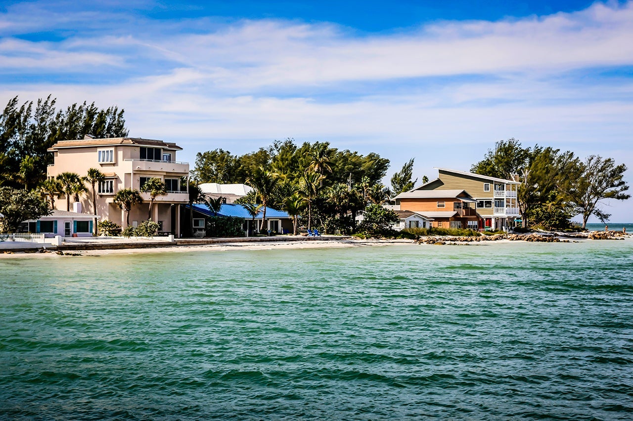 Homes on the shoreline of Anna Maria Island city overlooking the Gulf of Mexico in Florida. (Photo by csfotoimages / Getty Images)