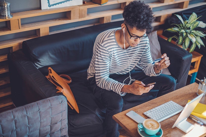 Young man working at home office