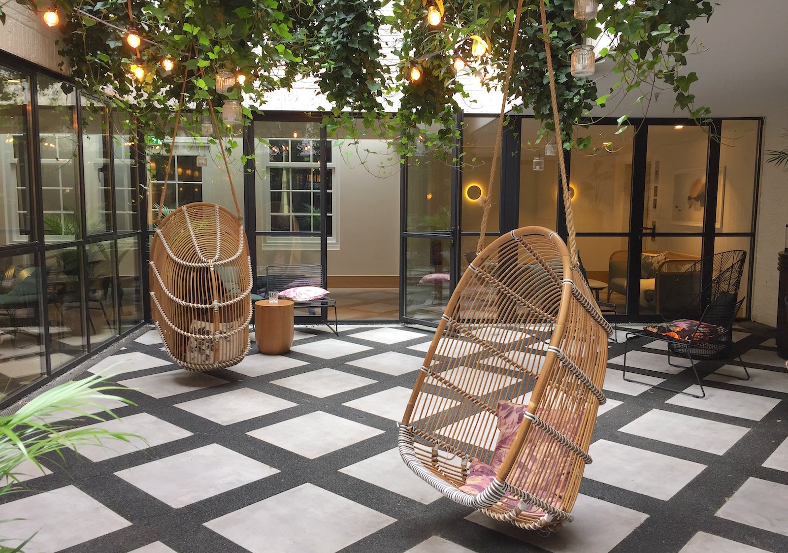 hanging wicker chairs in a hotel atrium
