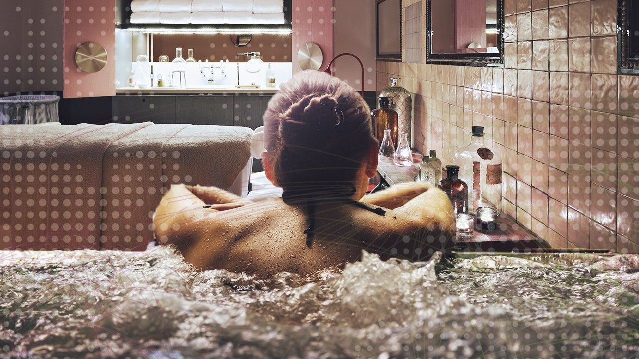 Woman relaxing in a jacuzzi pool during weekend days of relax and spa in a luxury place during travel vacations.