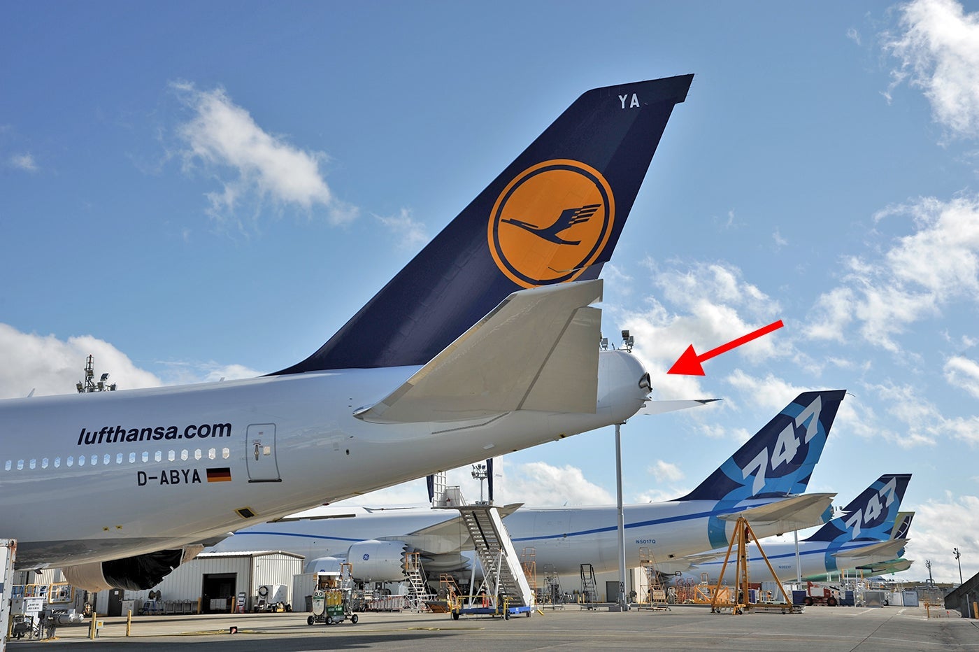 A Boeing 747-8 with an arrow indicating the APU exhaust (Photo by Alberto Riva / The Points Guy)