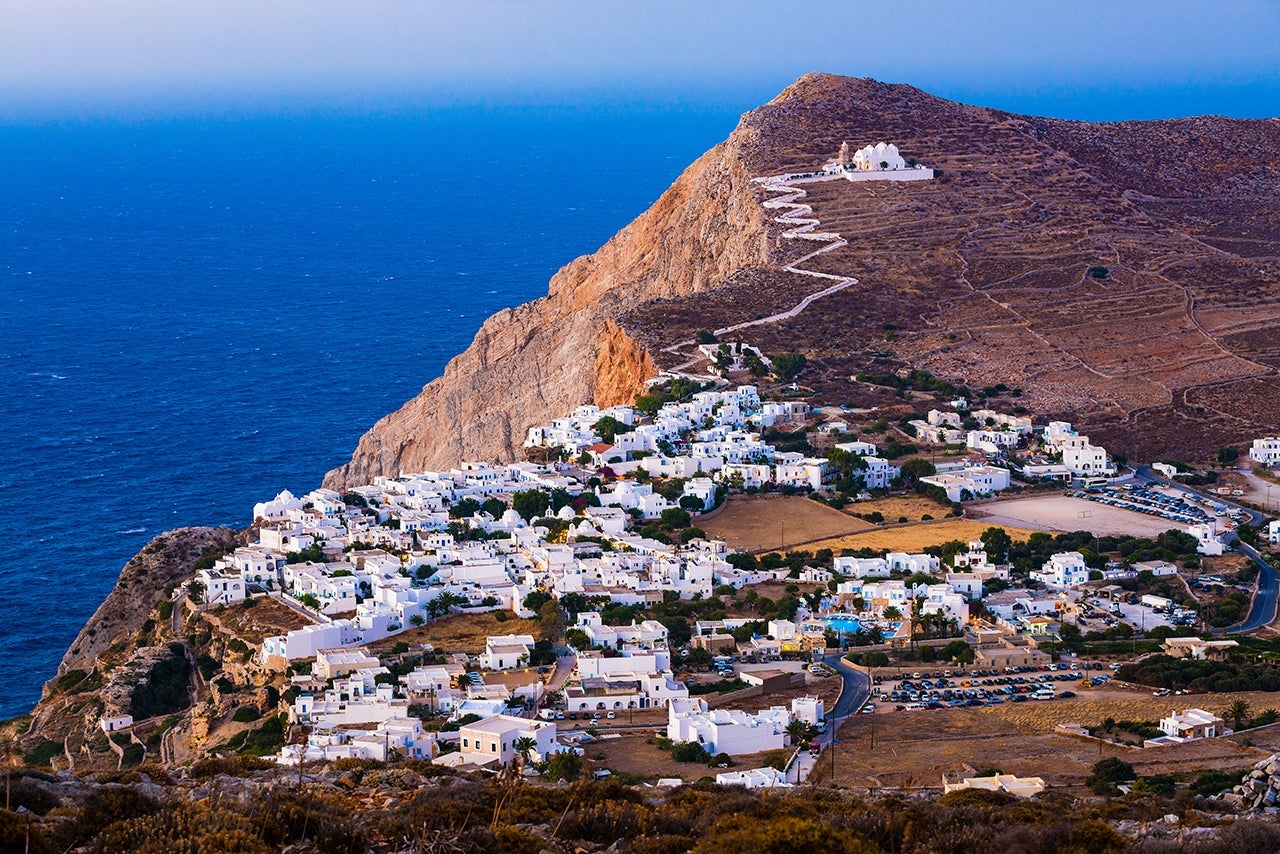 Chora on Folegandros island, Greece with beautiful Orthodox church of Panagia (Virgin Mary) on hill above. (Photo by mbbirdy / Getty Images)