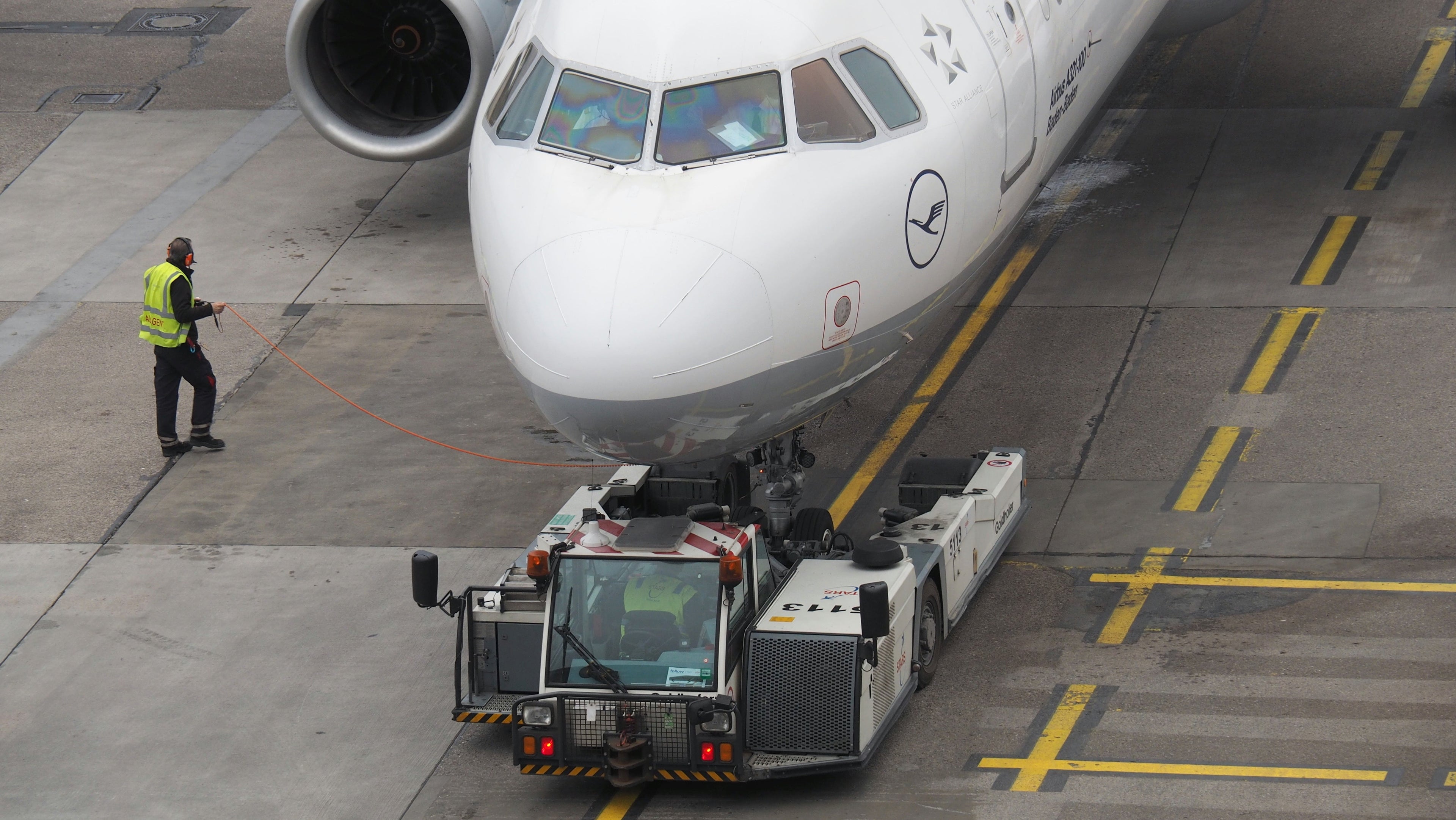 A Lufthansa Airbus A320  is pushed back from the gate by a tug that lifts up the front of the aircraft (Photo by Howard Slutsken)
