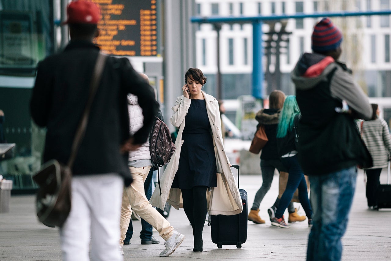 woman walking in airport on phone