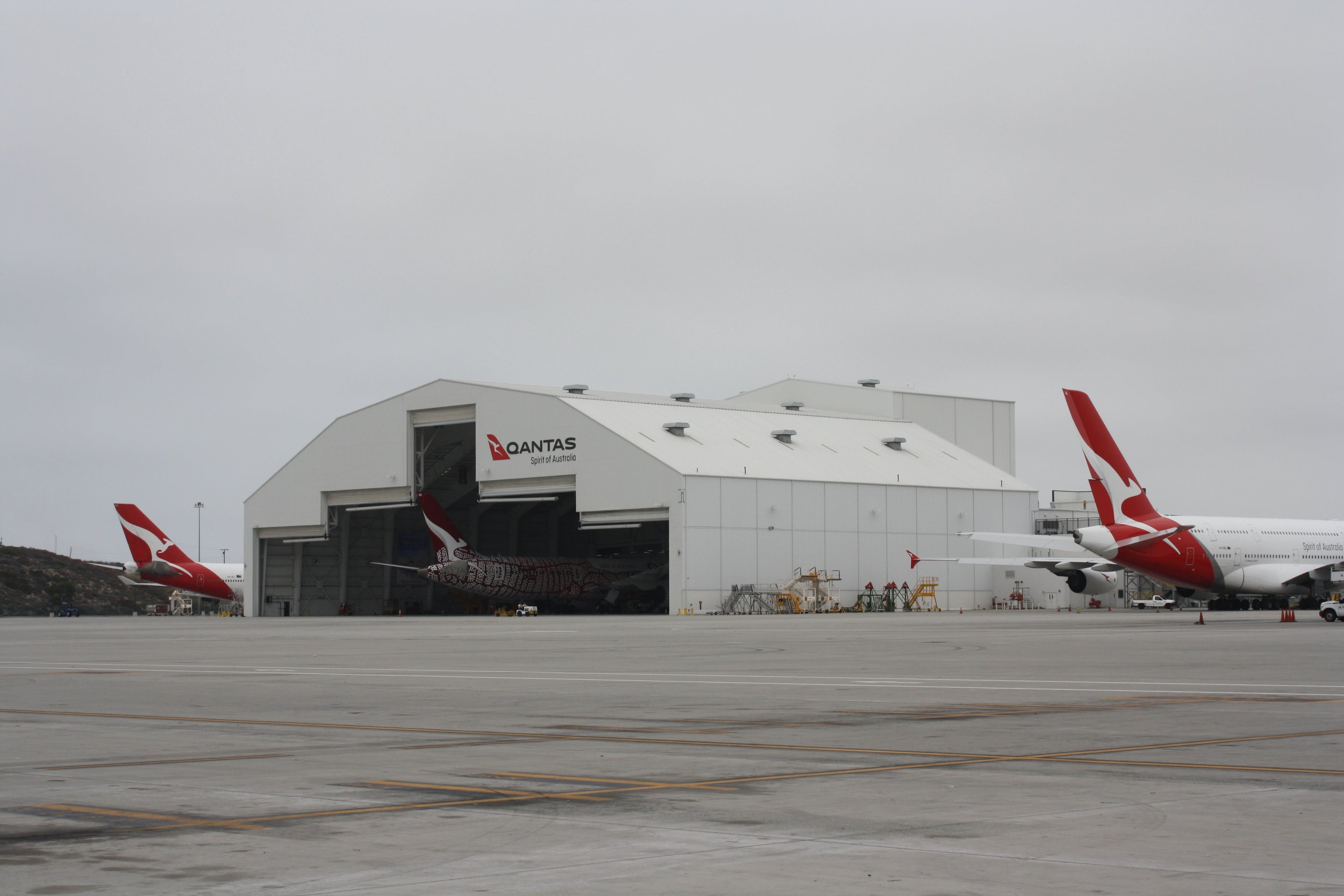 Three Qantas planes being readied for flights West