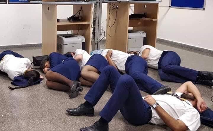 The staged photo showing the stranded Ryanair crew laying on the floor at Malga Airport in Spain (Image Courtesy of Jim Atkinson @Jimbaba on Twitter)