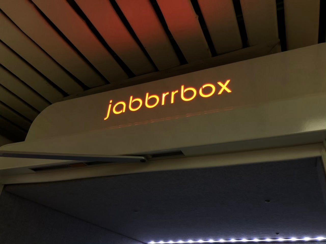 The Jabbrrbox Logo in Red Indicating The Pod Is In Use