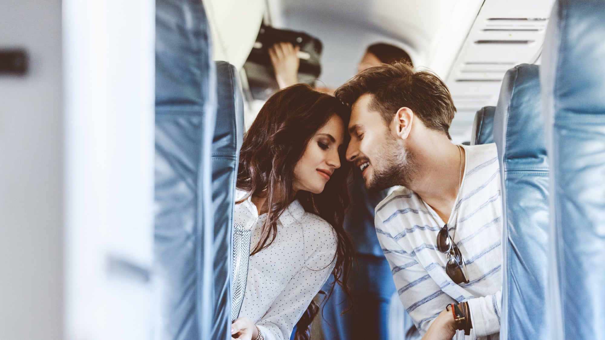 Loving young couple during flight