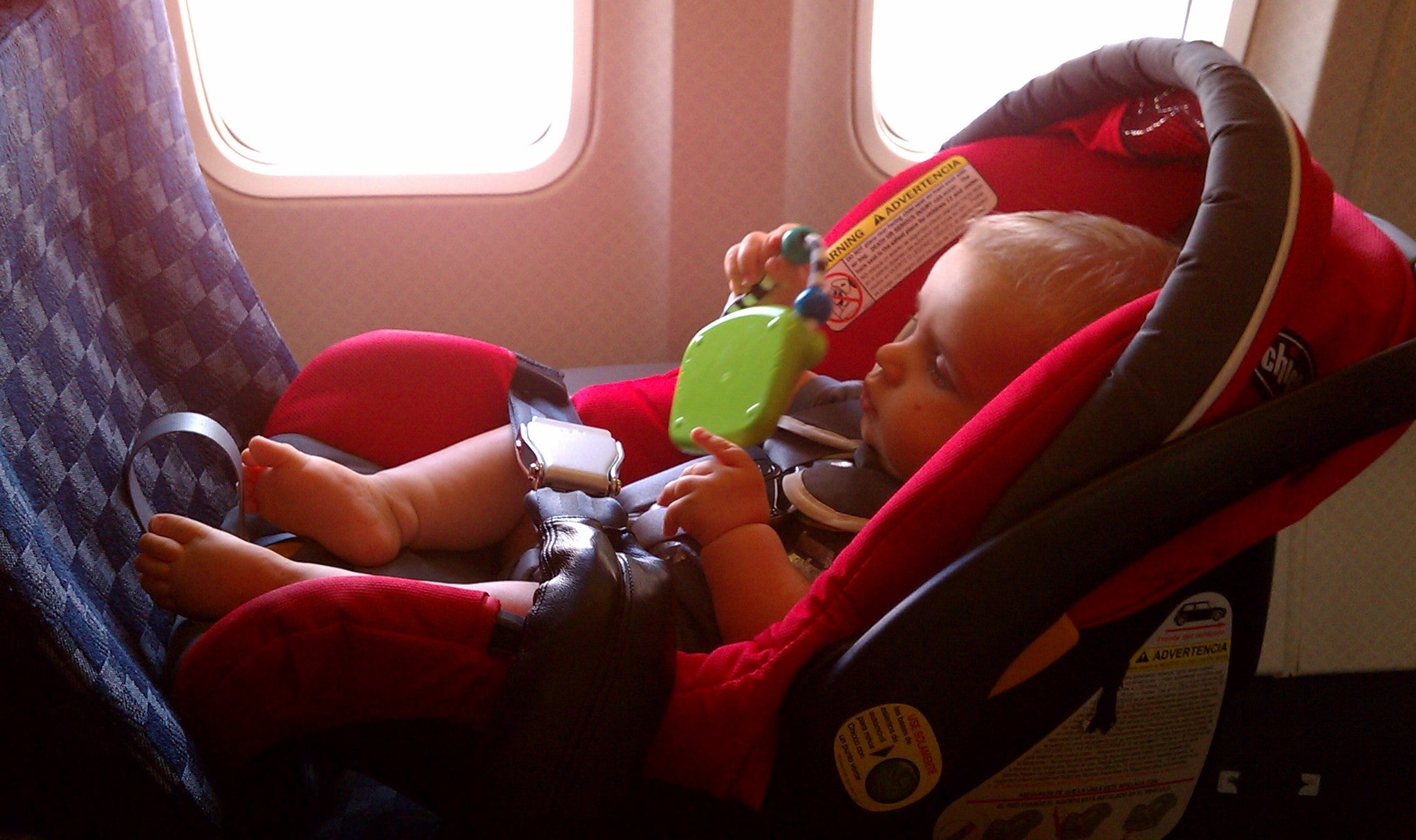Westin in his car seat on the plane