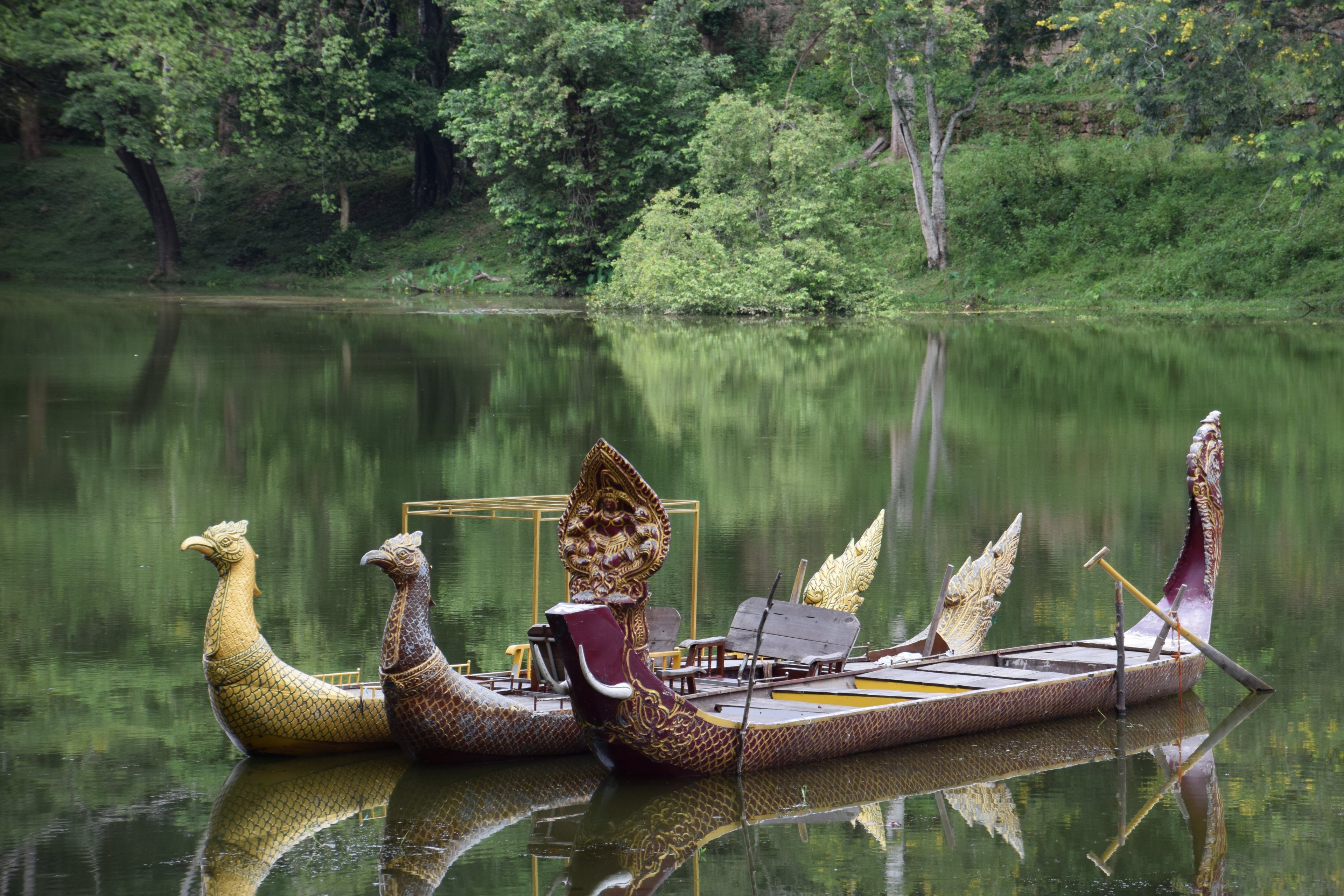 carved wooden boats in Cambodia