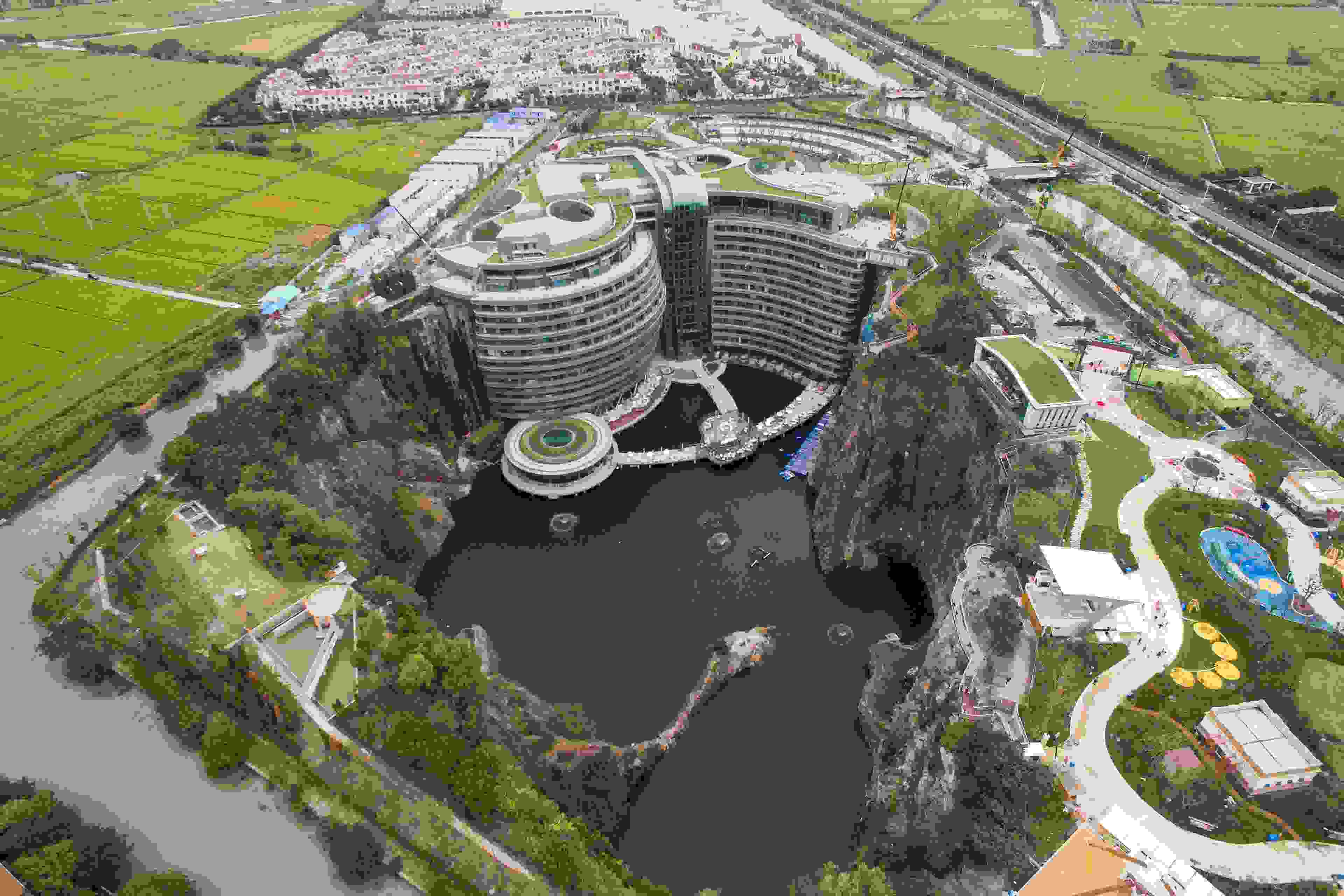 An aerial view of the luxury hotel InterContinental Shanghai Wonderland built inside a deserted quarry pit in southwestern Shanghai, China Wednesday, Oct. 10, 2018. The building has 18 floors, 16 of which are below ground including two submerged under water. After multiple delays, the hotel, designed by British firm Atkins, will finally open later this year.PHOTOGRAPH BY Feature China / Barcroft Images (Photo credit should read Feature China / Barcroft Images / Barcroft Media via Getty Images)