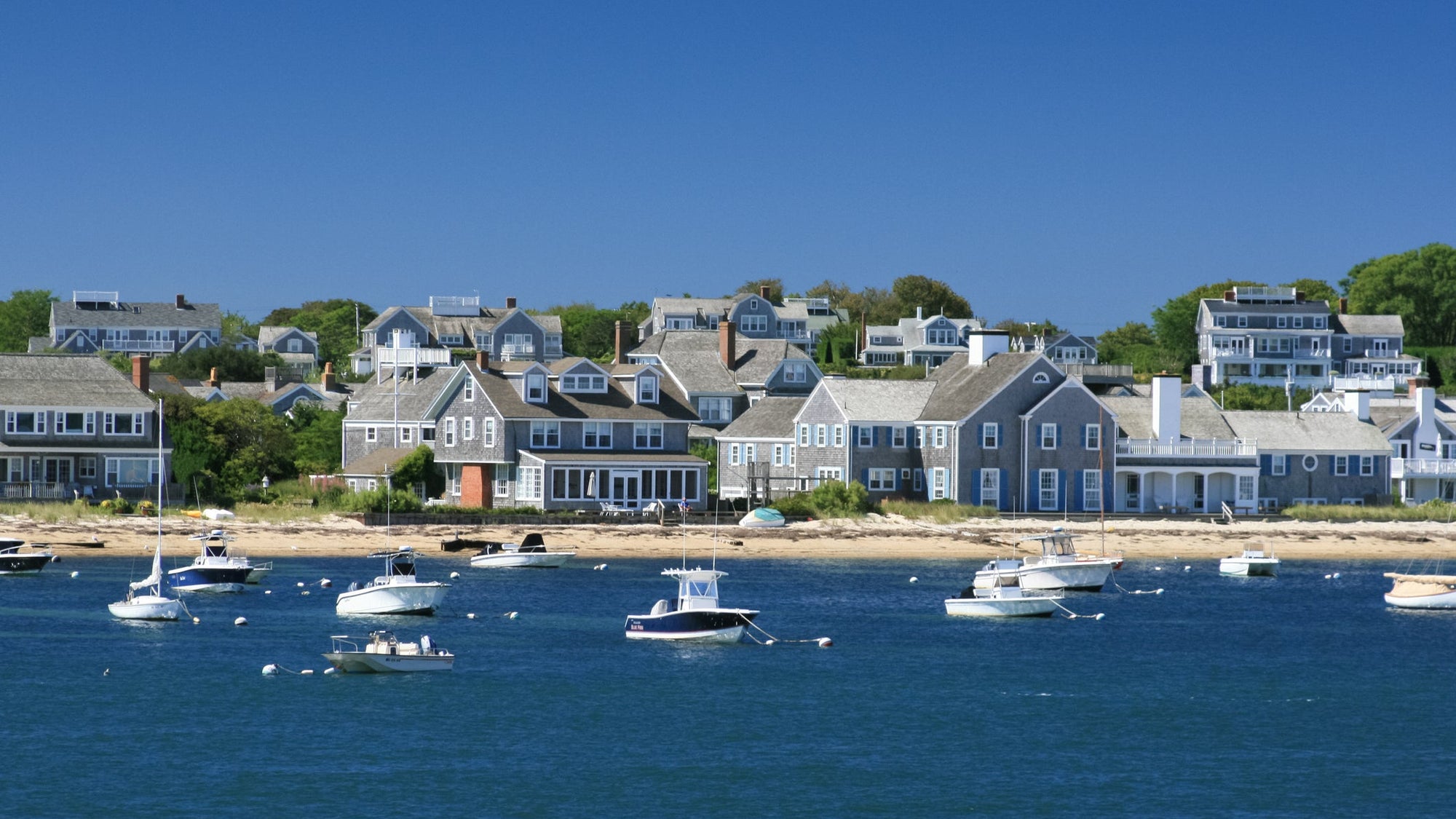 Boats and waterfront Houses, Nantucket, Massachusetts. Clear blue sky.