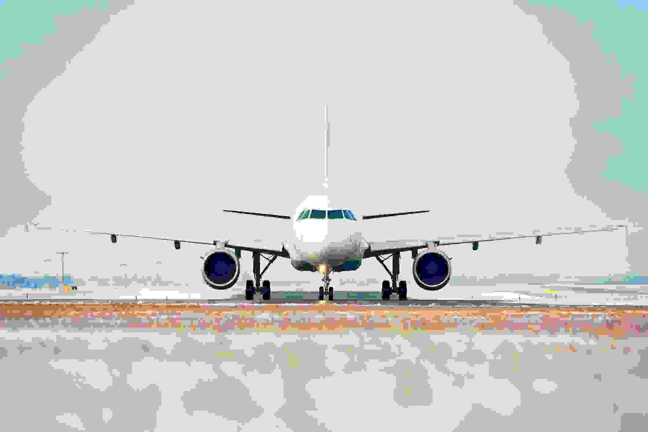 An airplane on an airport runway. (Credit: Jaromir Chalabala/EyeEm via Getty Images)