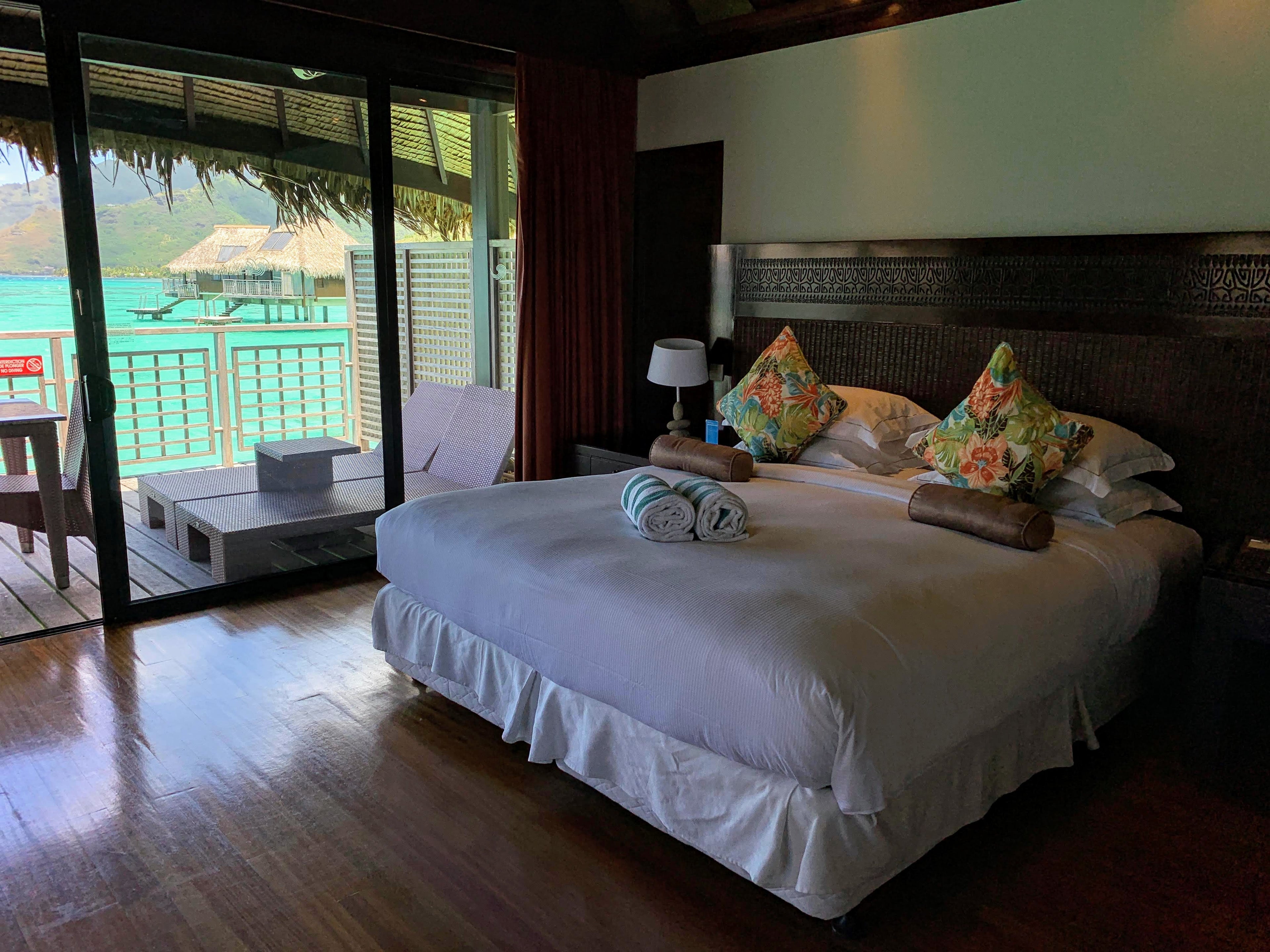 Hilton Moorea Lagoon Resort and Spa - overwater bungalow bed