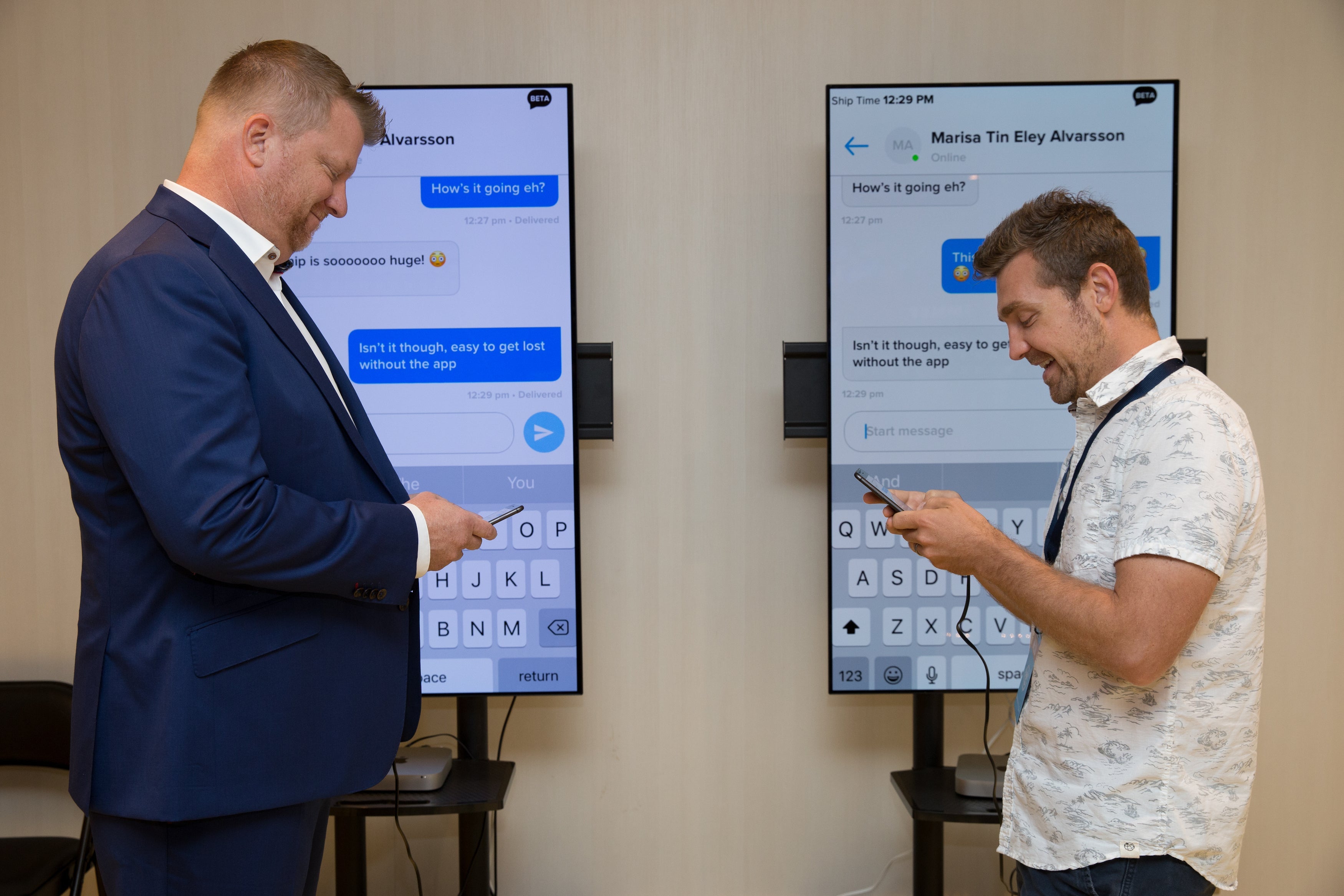 Tim Klauda (left) and Darren Murph (right) demo Royal Caribbean's guest-to-guest chat onboard Symphony of the Seas