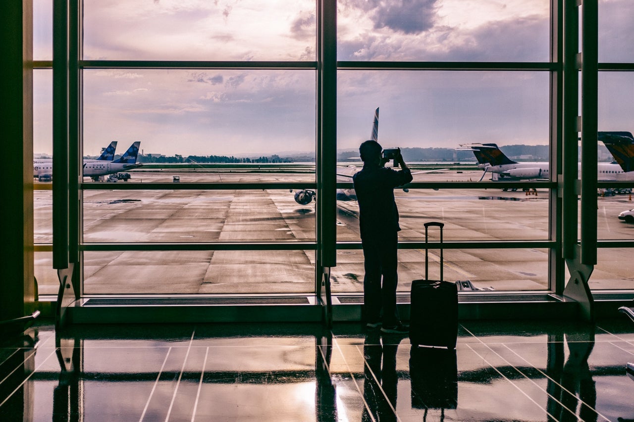 The taller you are, the longer the handle should be on your rolling suitcase. (Photo by Ashim D'Silva via Unsplash)