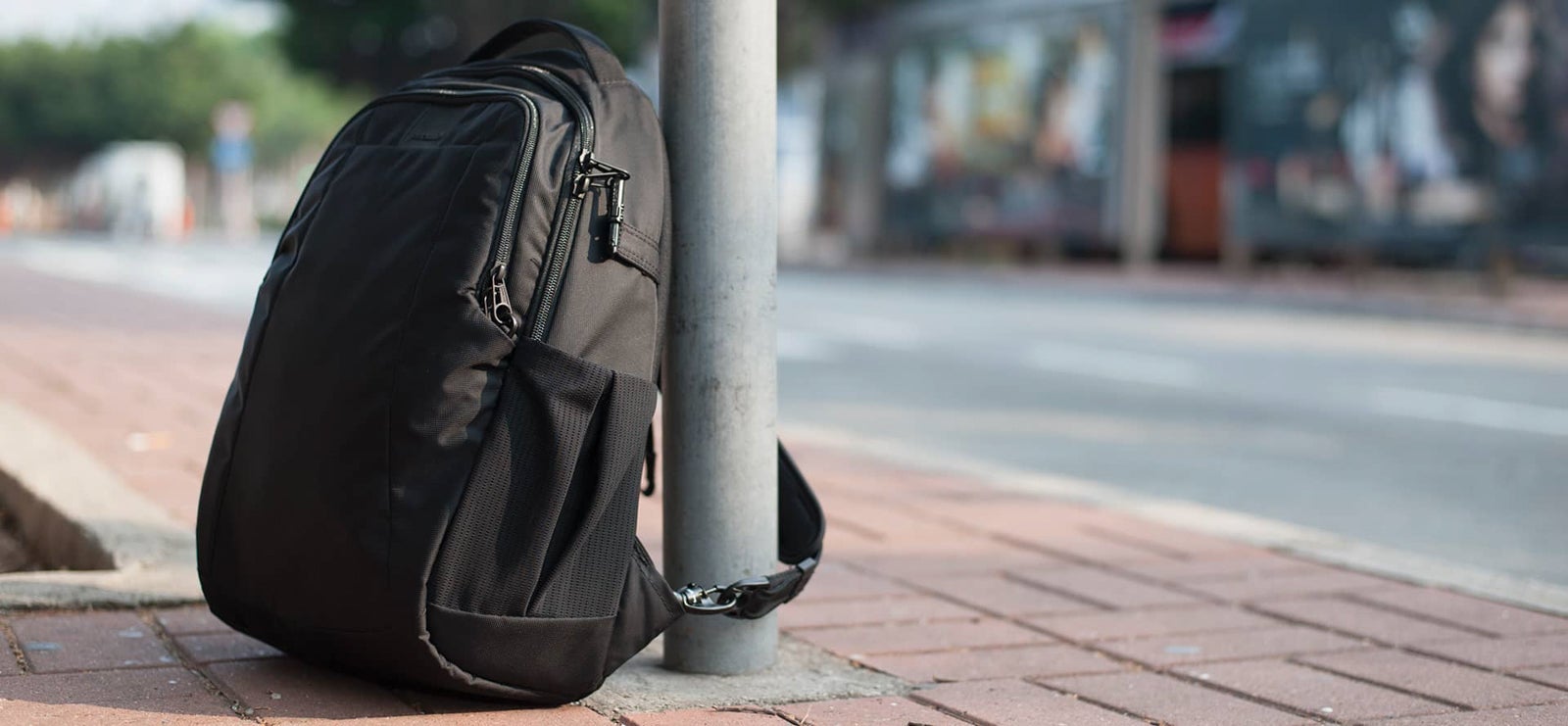 There are plenty of products out there to keep your items from getting stolen, like the PacSafe bag above, which have straps and locking cables to secure your bag to any anchor. (Image via PacSafe.com)