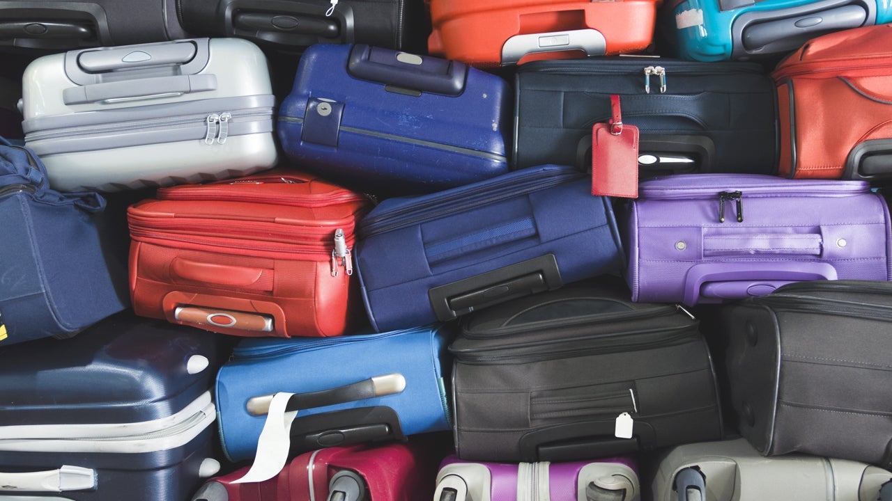pile of suitcases_photo via shutterstock