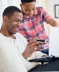 Father and son shopping online