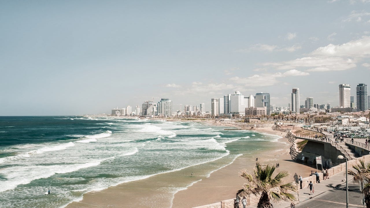 Scenic View Of Sea And Tel Aviv Cityscape Against Clear Sky
