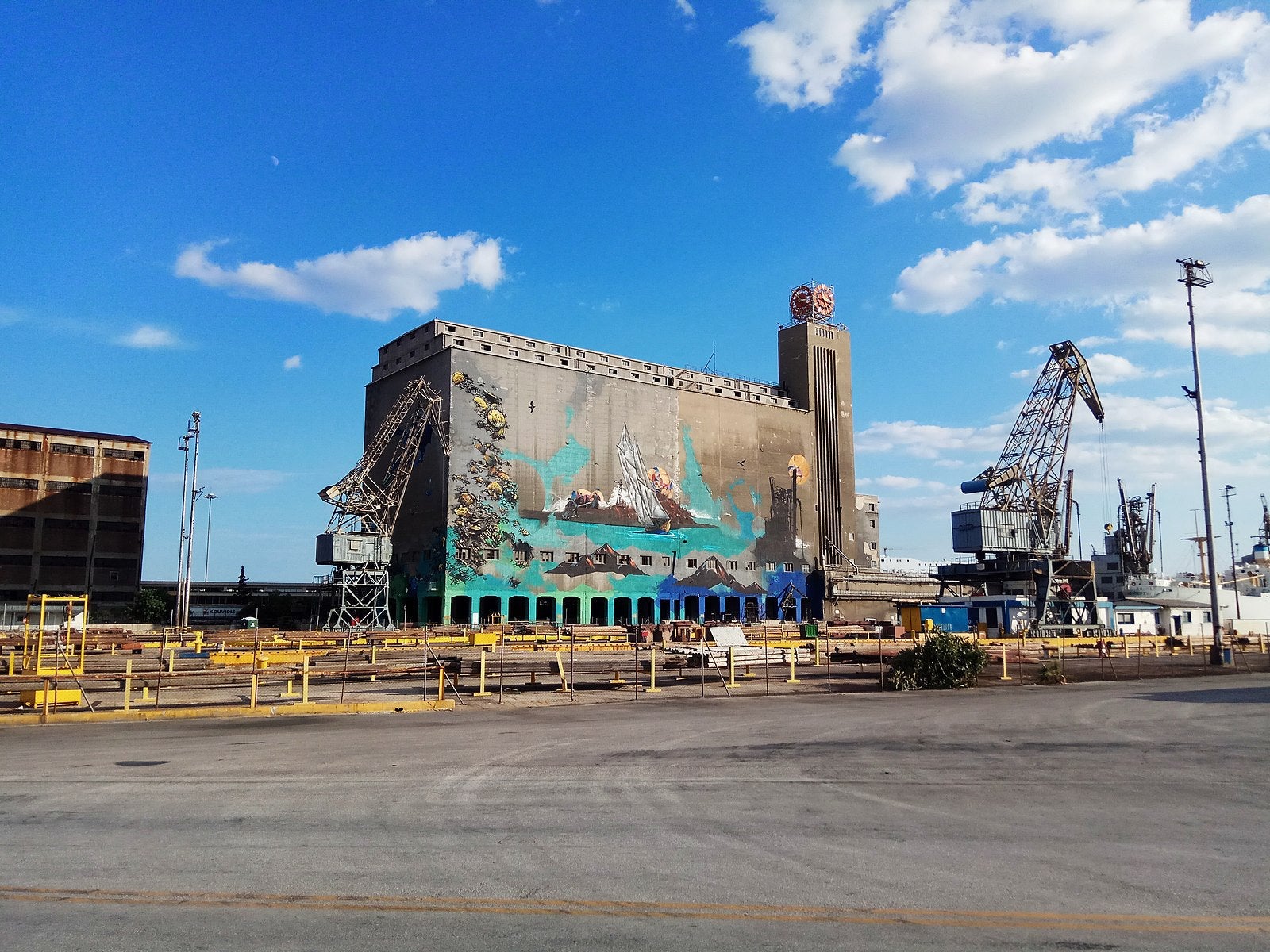 Full of great seafood restaurants and street art too, the life of Piraeus still revolves around the port. (Photo via Wikimedia Commons)