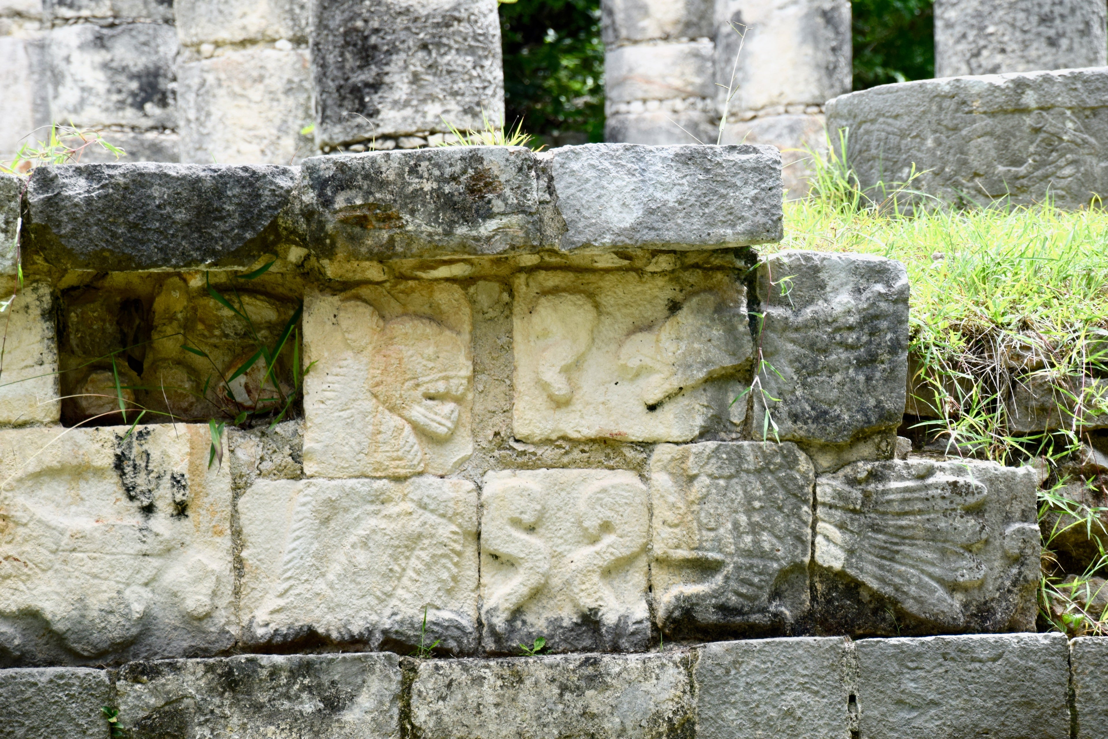 stone carvings of Mayan gods at Chichen Itza