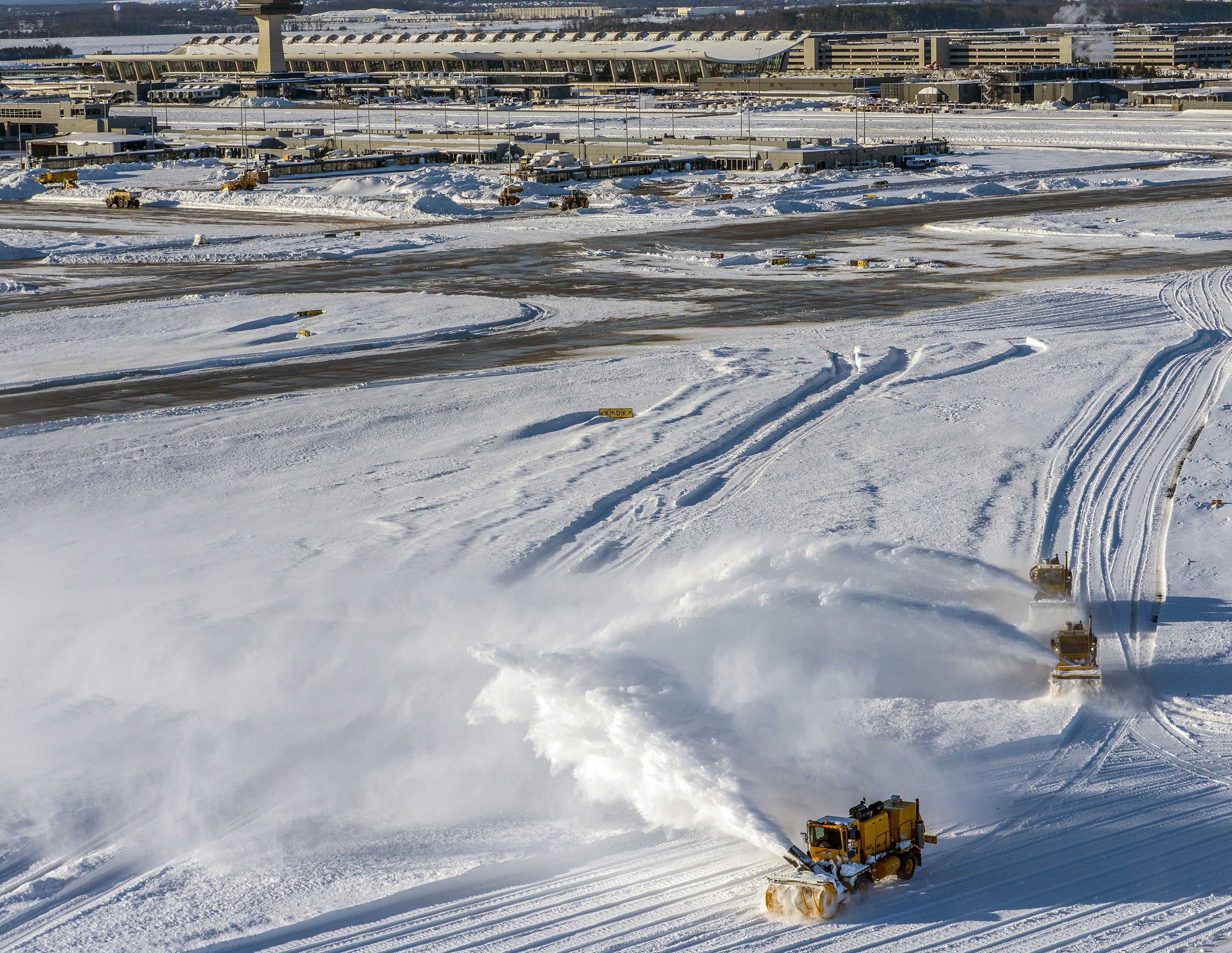 DULLES, VA - JANUARY 24:Snow removers clear the runways at Dulles International Airport in the aftermath of the big blizzard on January, 24, 2016 in Dulles, VA. (Photo by Bill O'Leary/The Washington Post via Getty Images)