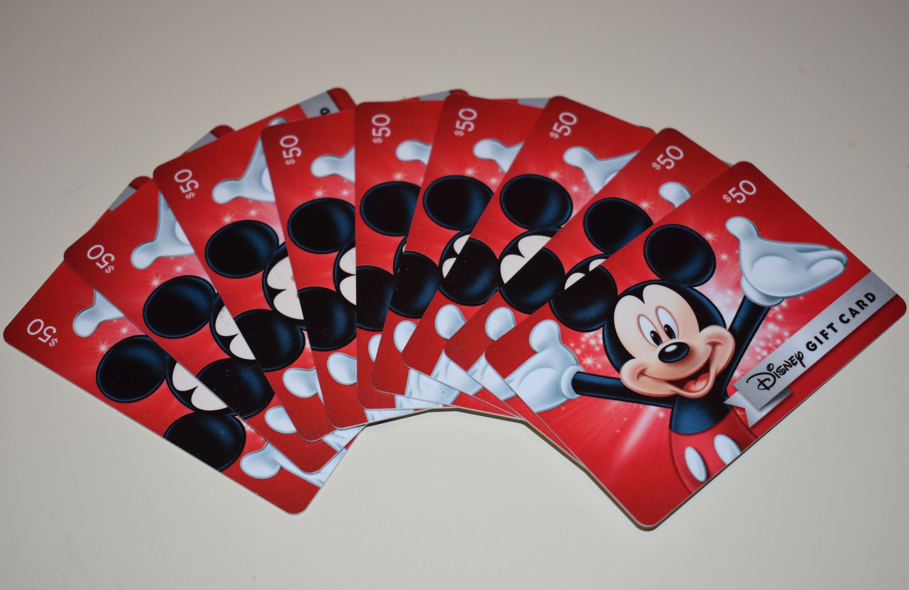 The stack of Disney gift cards I used to upgrade to an annual pass. Image by Ross Binkley / The Points Guy.