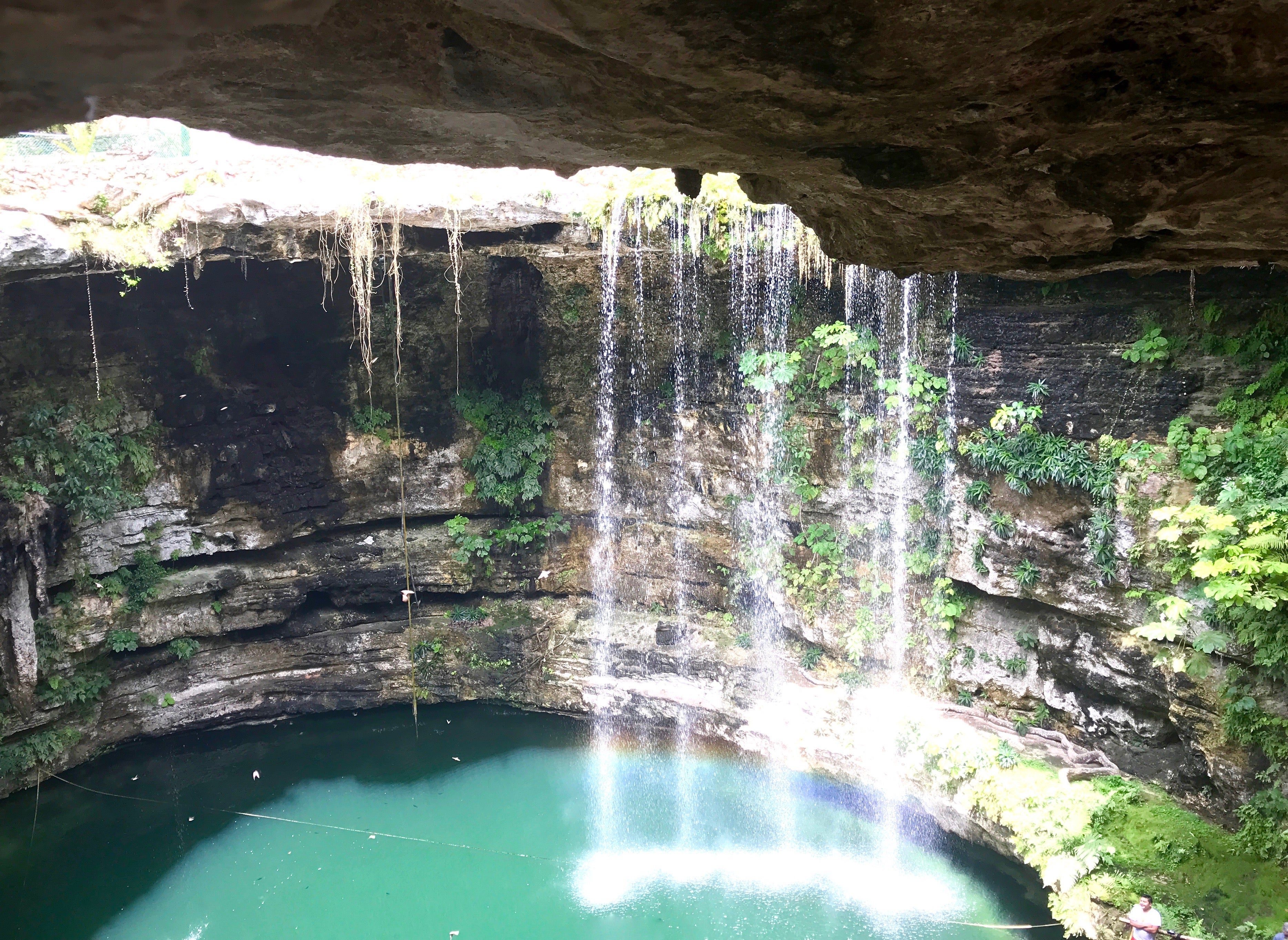 cenote with waterfall in Yucatan Mexico