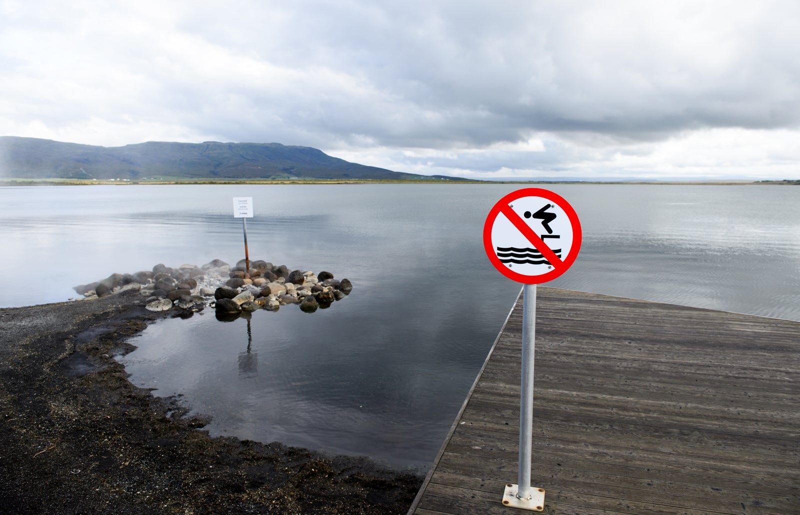 Lake side view and no diving sign at The Laugarvatn Fontana Nature Baths, in the south of Iceland