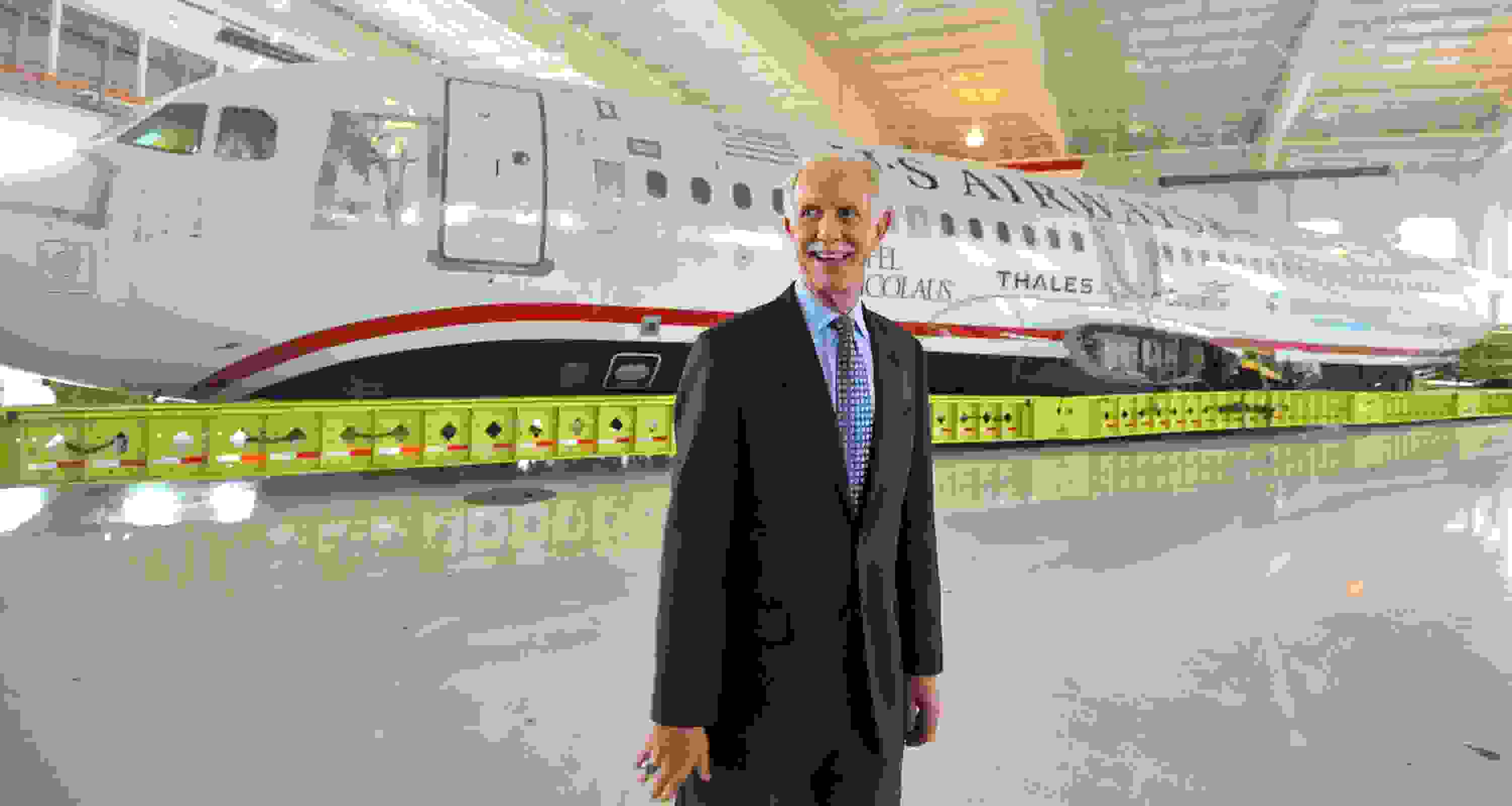 Capt. Chesley Sullenberger, stands in front of the US Airways flight 1549 fuselage at the Carolinas Aviation Museum Saturday, June 11, 2011. Sullenberger and other crew members met with passengers to recall their memorable water landing in the Hudson River and to celebrate the plane's arrival at the museum. (Todd Sumlin/Charlotte Observer/MCT via Getty Images)