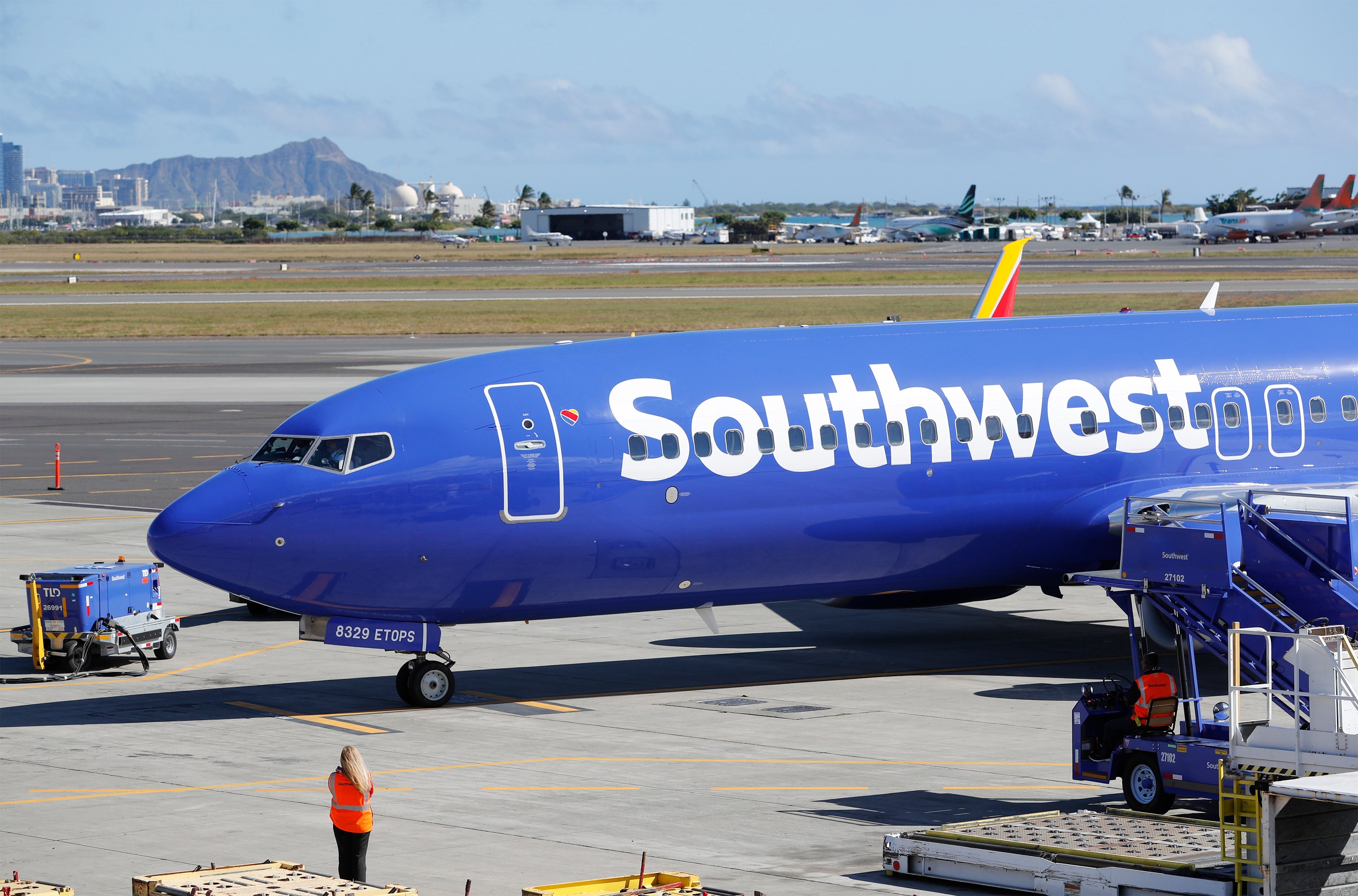 A Southwest Airlines 737 800 flight lands for the first time at Honolulu International Airport, Tuesday, February 5, 2019, in Honolulu. (Marco Garcia/The Points Guy)