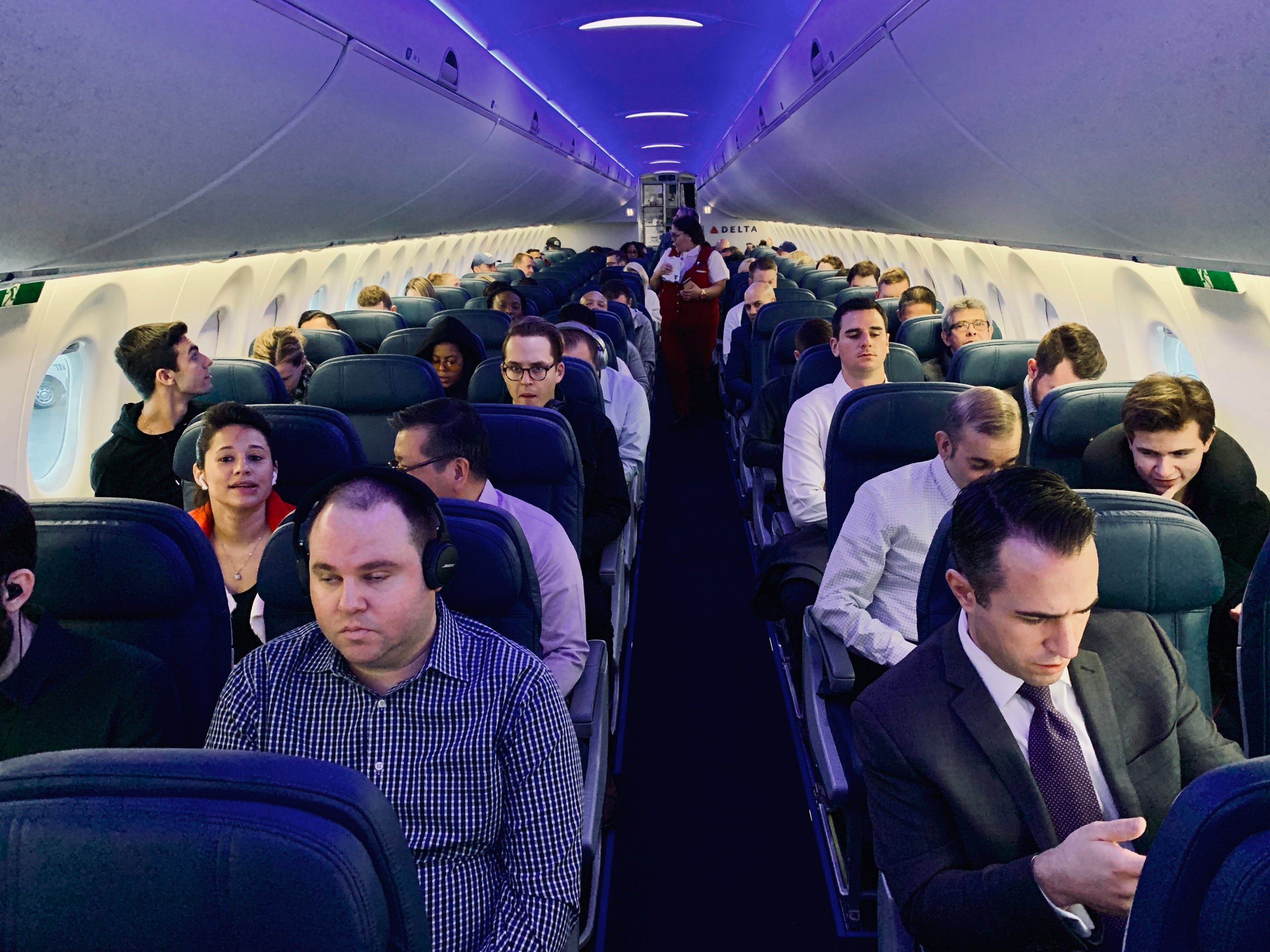 Passengers in Delta's A220 main cabin