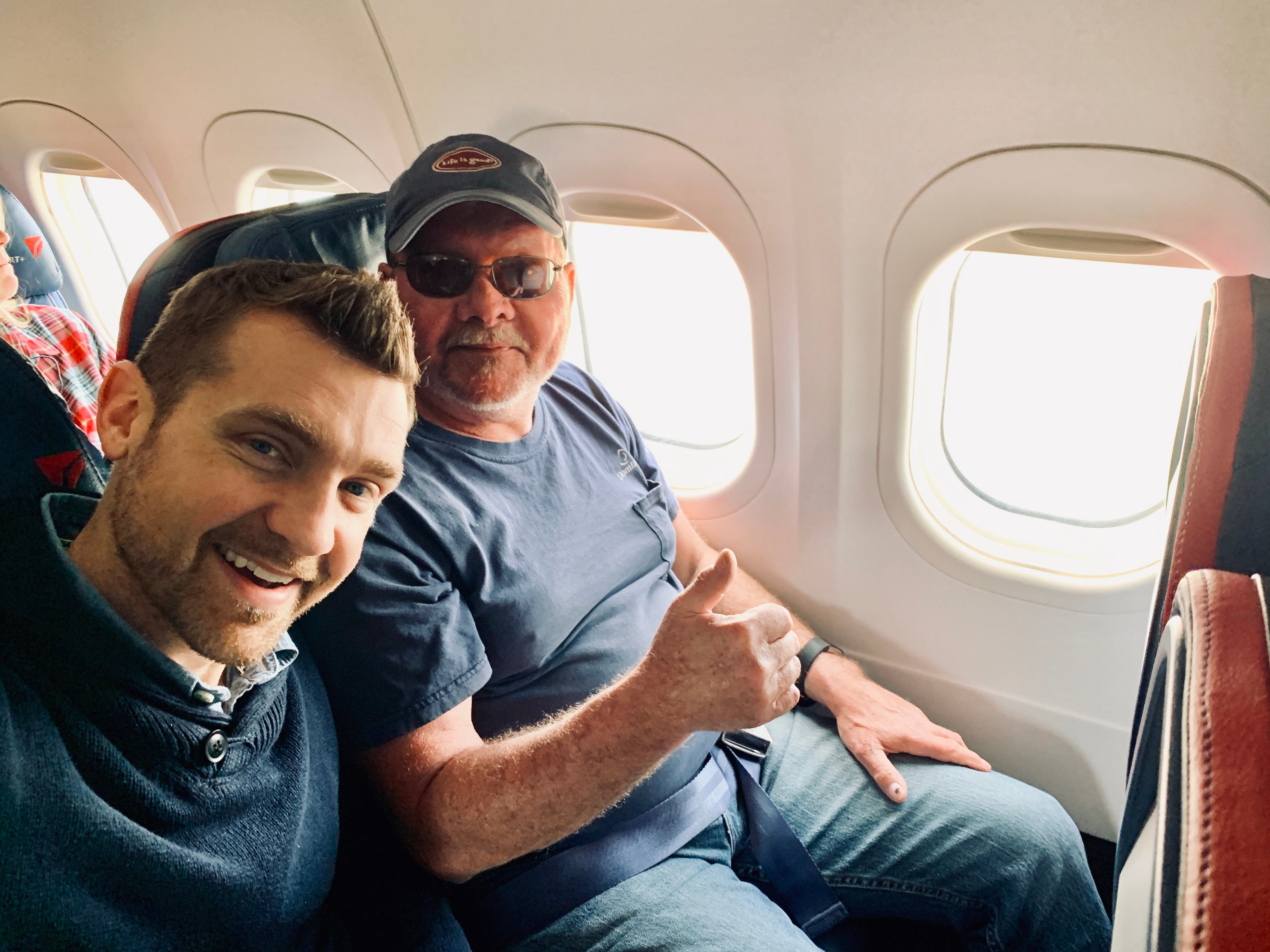 family travel babysitter grandpa in flight