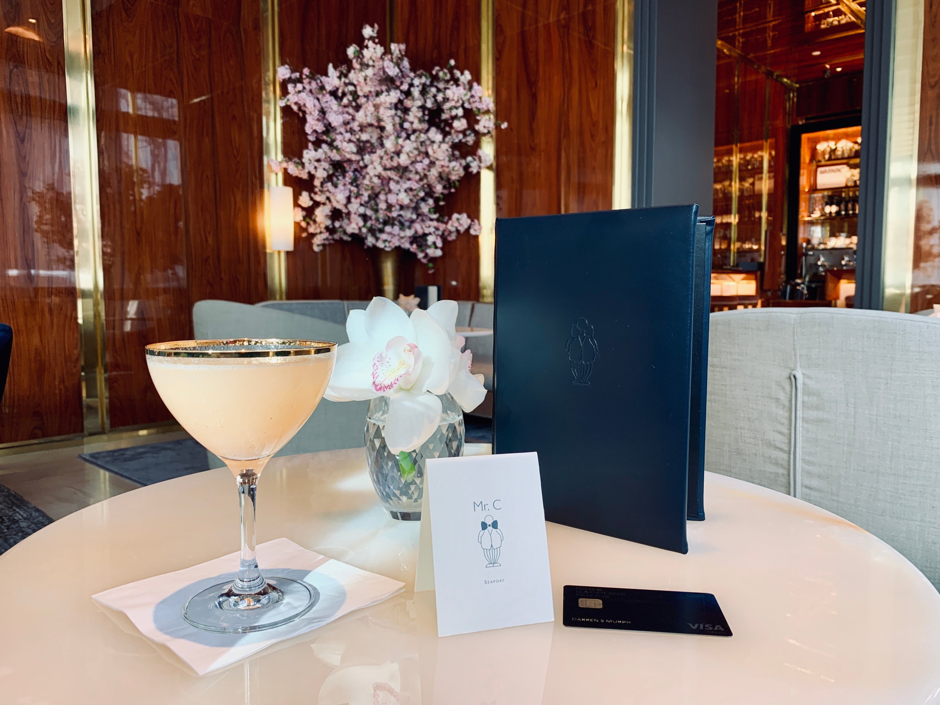 Mr. C Seaport guests receive a welcome Bellini upon check-in