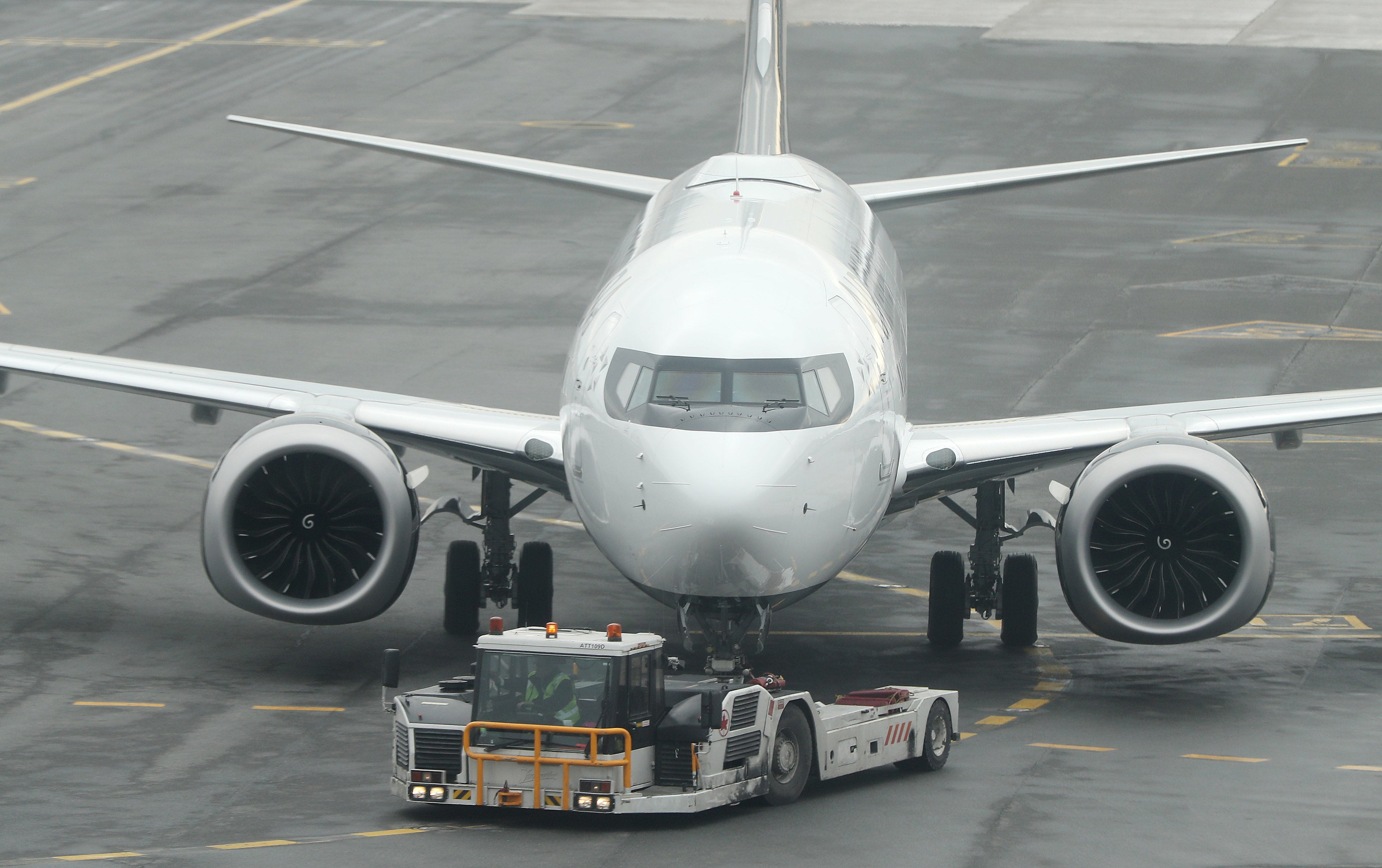 TORONTO, ON- MARCH 13 - Air Canada Registration number C-GEHV which had just come in as Flight AC 758, from San Francisco, a Boeing 737 Max 8, is rolled out of the gate after being grounded, in Toronto. March 13, 2019. (Steve Russell/Toronto Star via Getty Images)