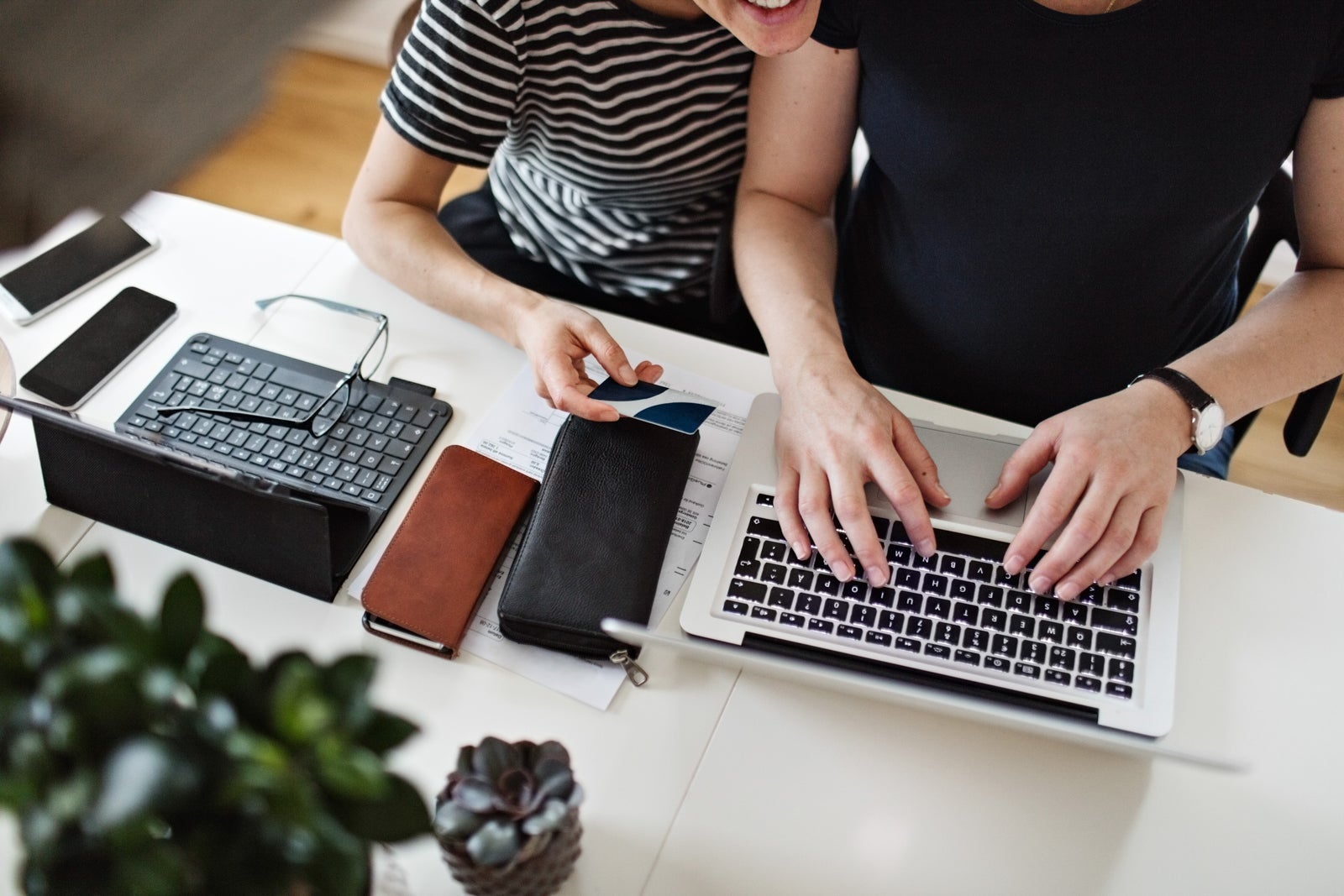 two people use a computer