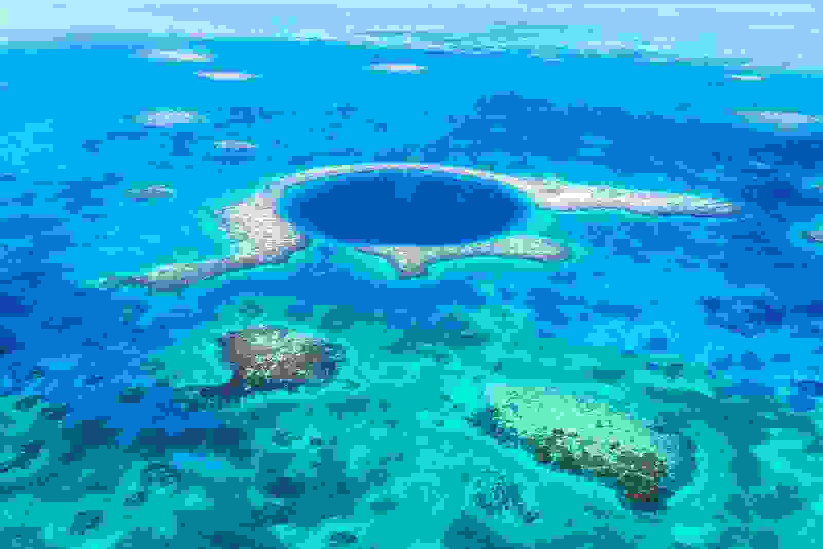 Aerial photo of the Blue Hole, Lighthouse reef, Belize. (Photo via Getty Images)