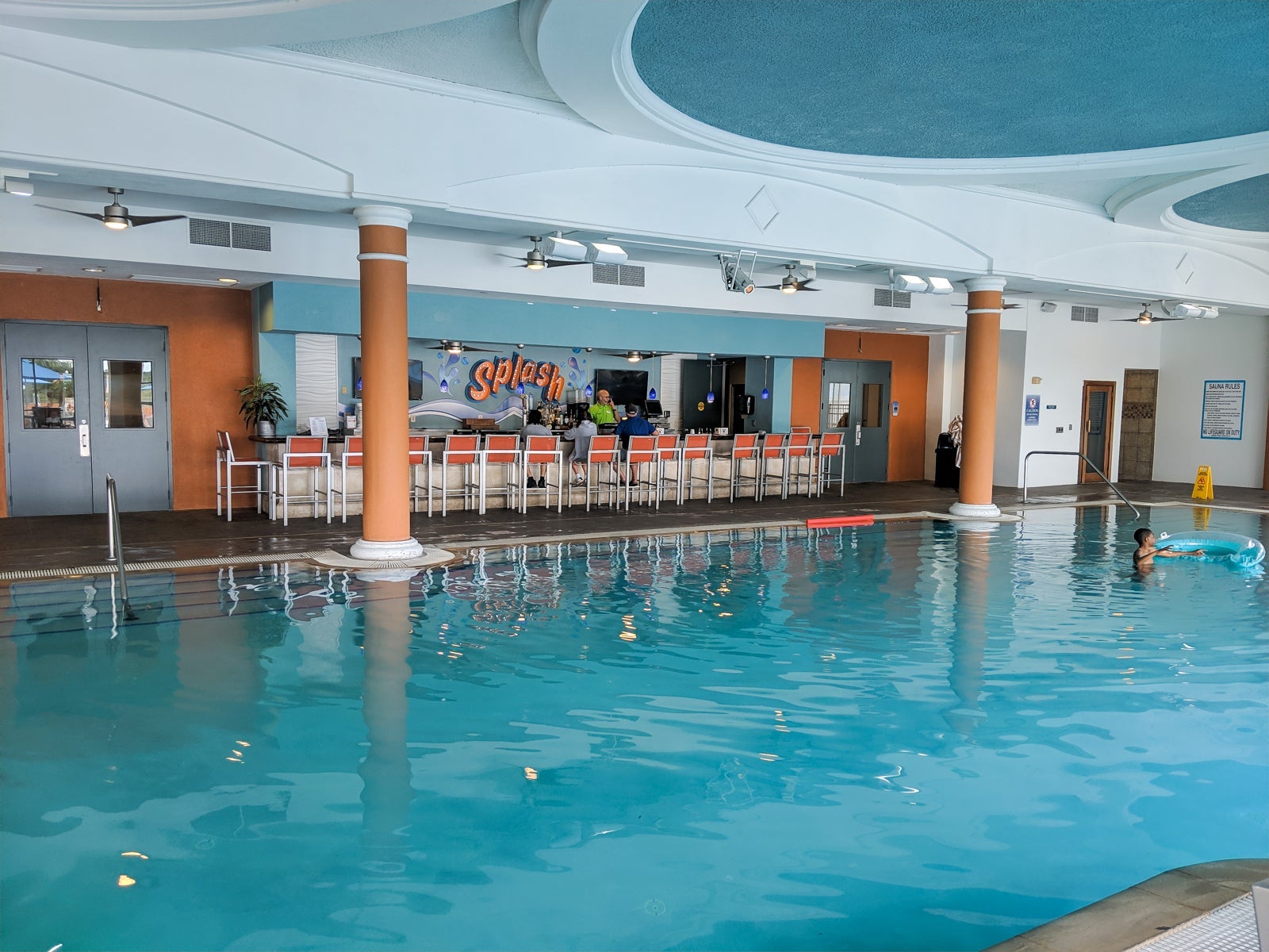 A pool-side bar served drinks and limited food next to the indoor / outdoor pool.