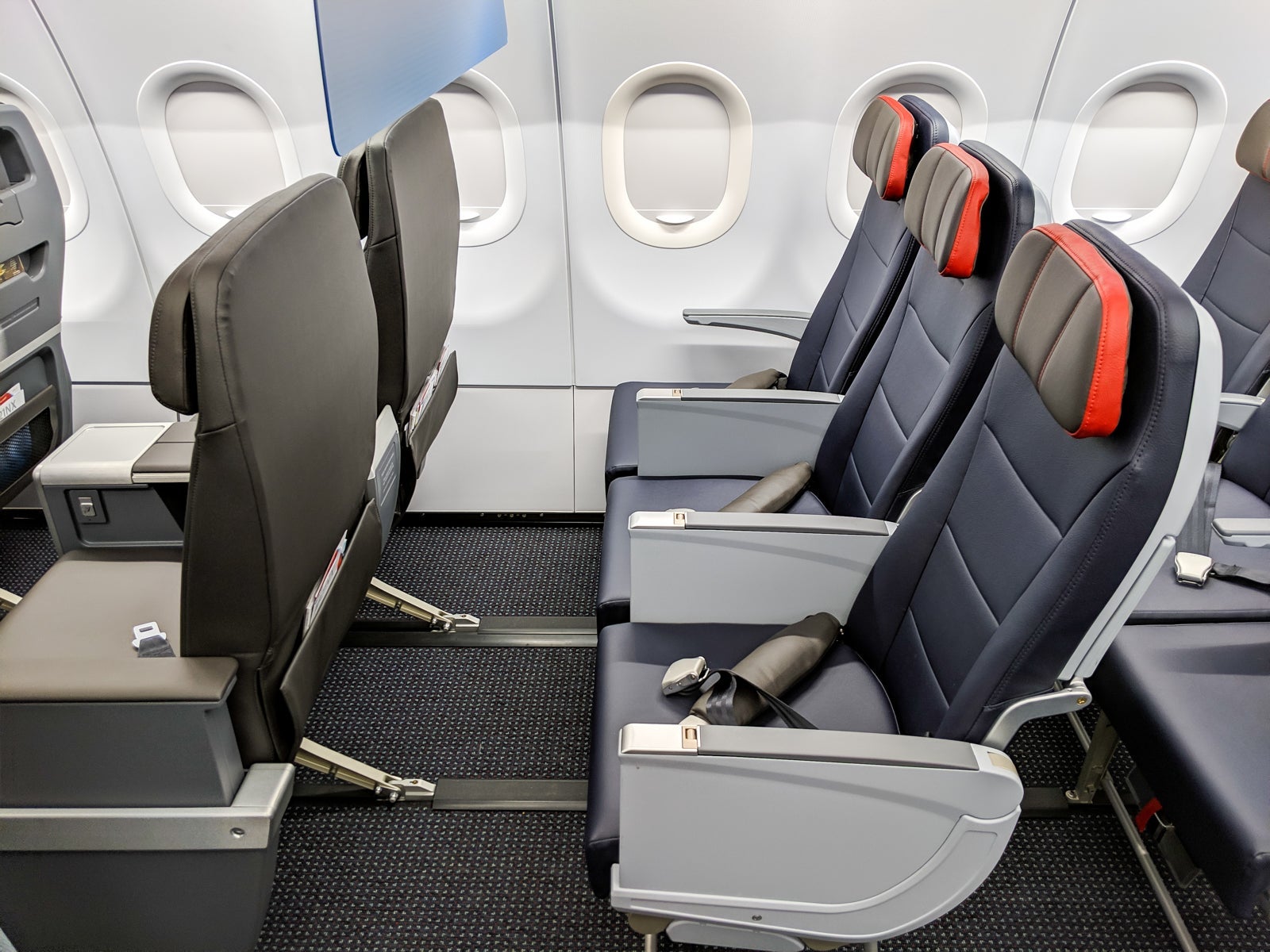 The front row of economy on the American Airline A321neo measures 40 inches of pitch -- and you can store a bag under the first class seat in front of you. (Photo by JT Genter/The Points Guy)