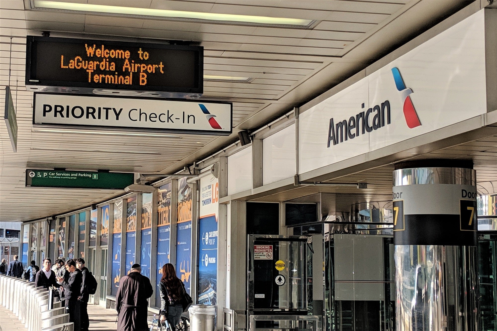 priority airport check-in signs for American Airlines elites