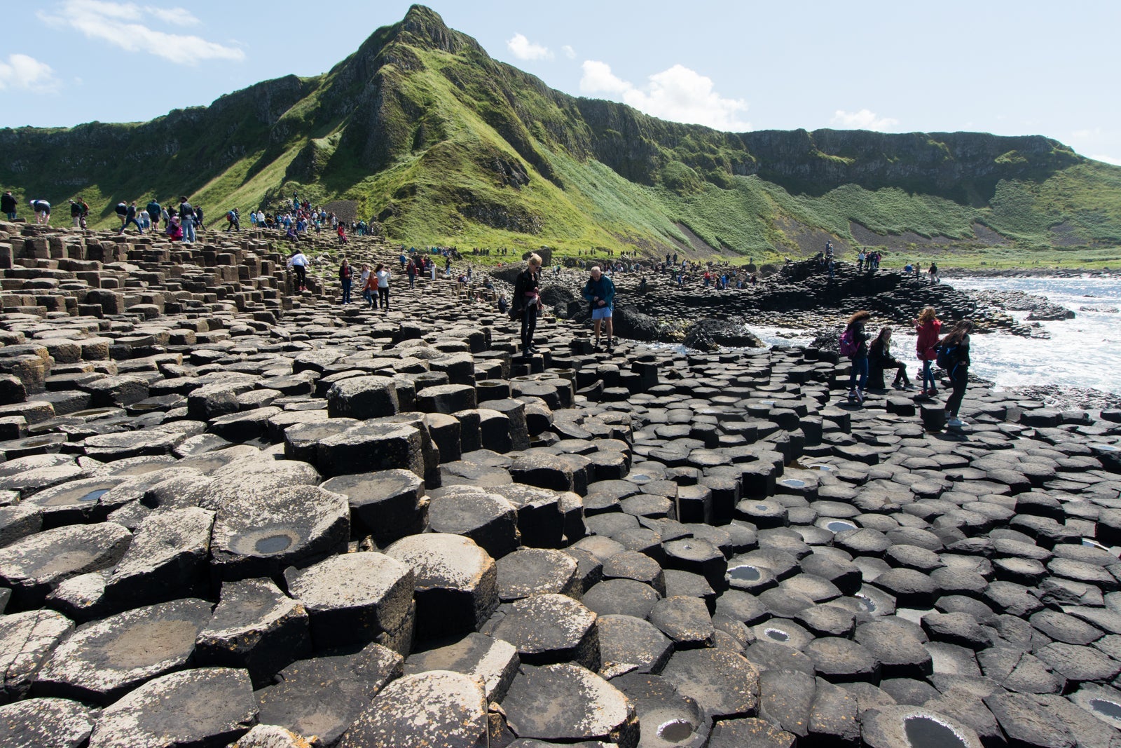 A crowd of tourists to see Giant's Causeway. (Photo by LuckyTD / Getty Images)